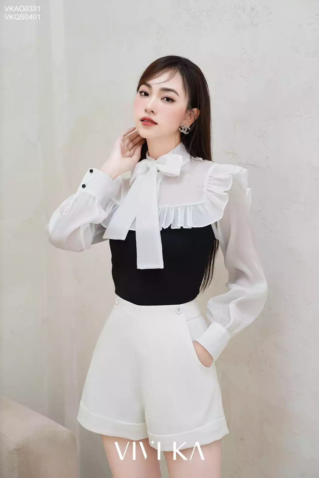Áo tay dài viền bèo cột nơ