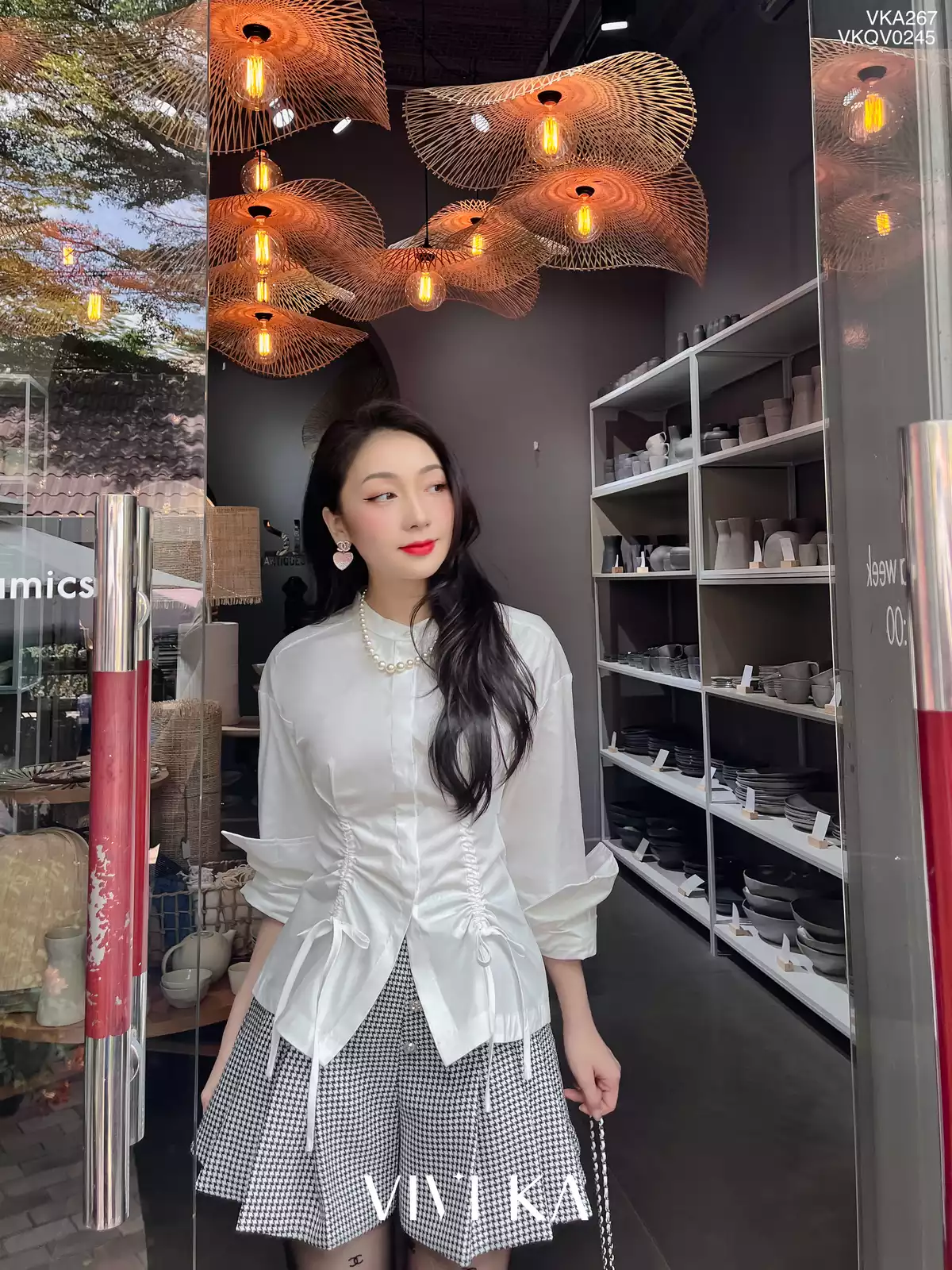 Quần váy tuýpsi én phối nút