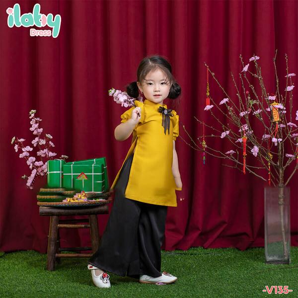 Áo dài tafta cài nơ quần đen