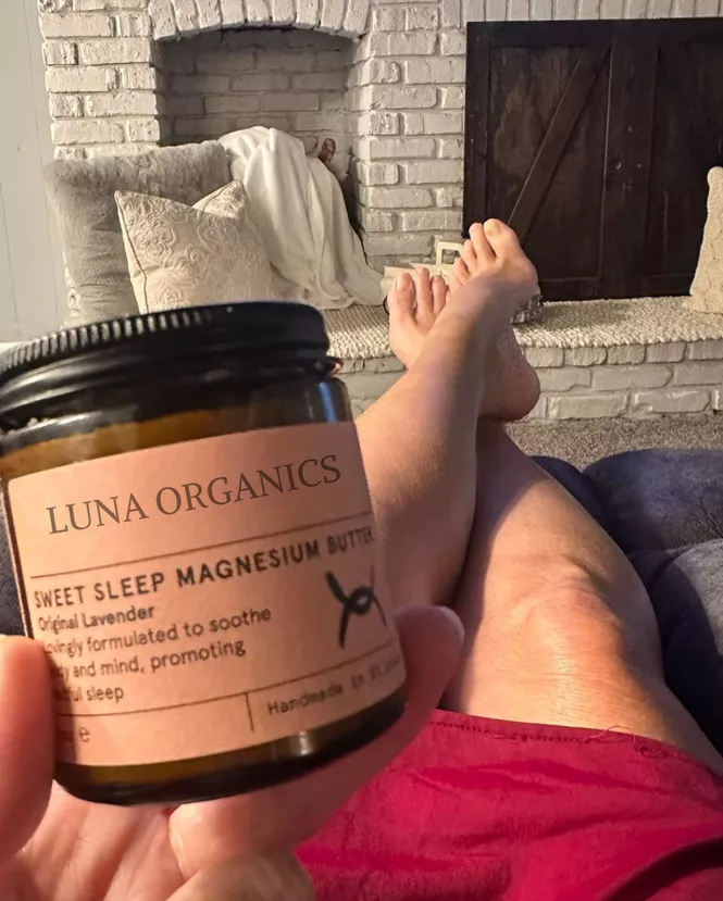 Review Photo 1 – customer Lyka D. relaxing with feet up, holding a Sweet Sleep jar