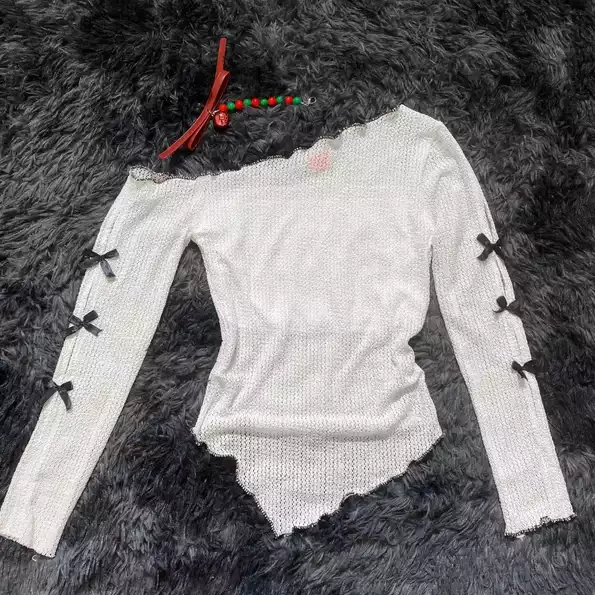 Product image - ເສື້ອປັກໄຫຼ່ ແຂນໂບ