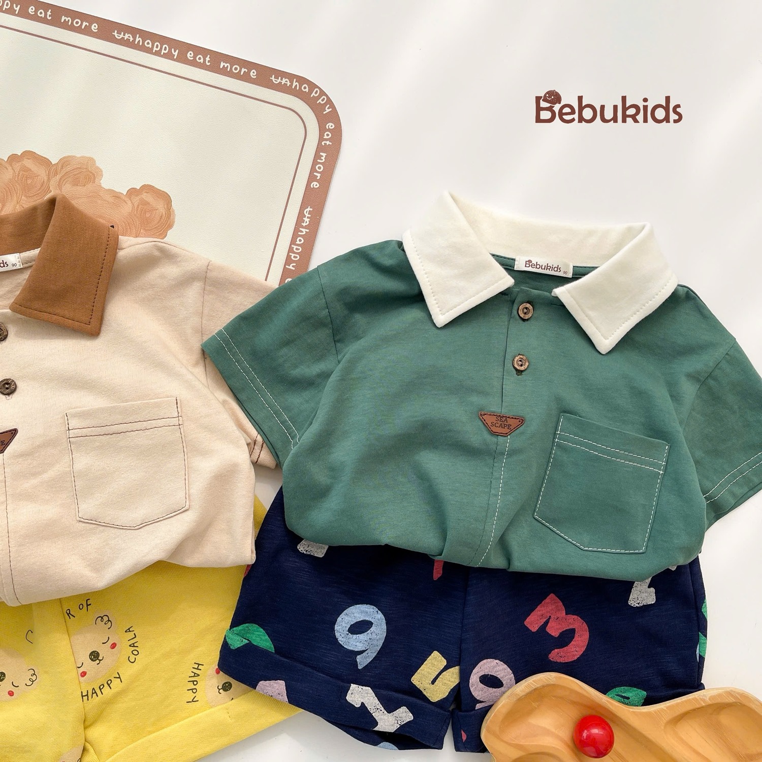 SB2232- bộ polo diễu chỉ nổi túi ngực phối quần gấu, chữ số