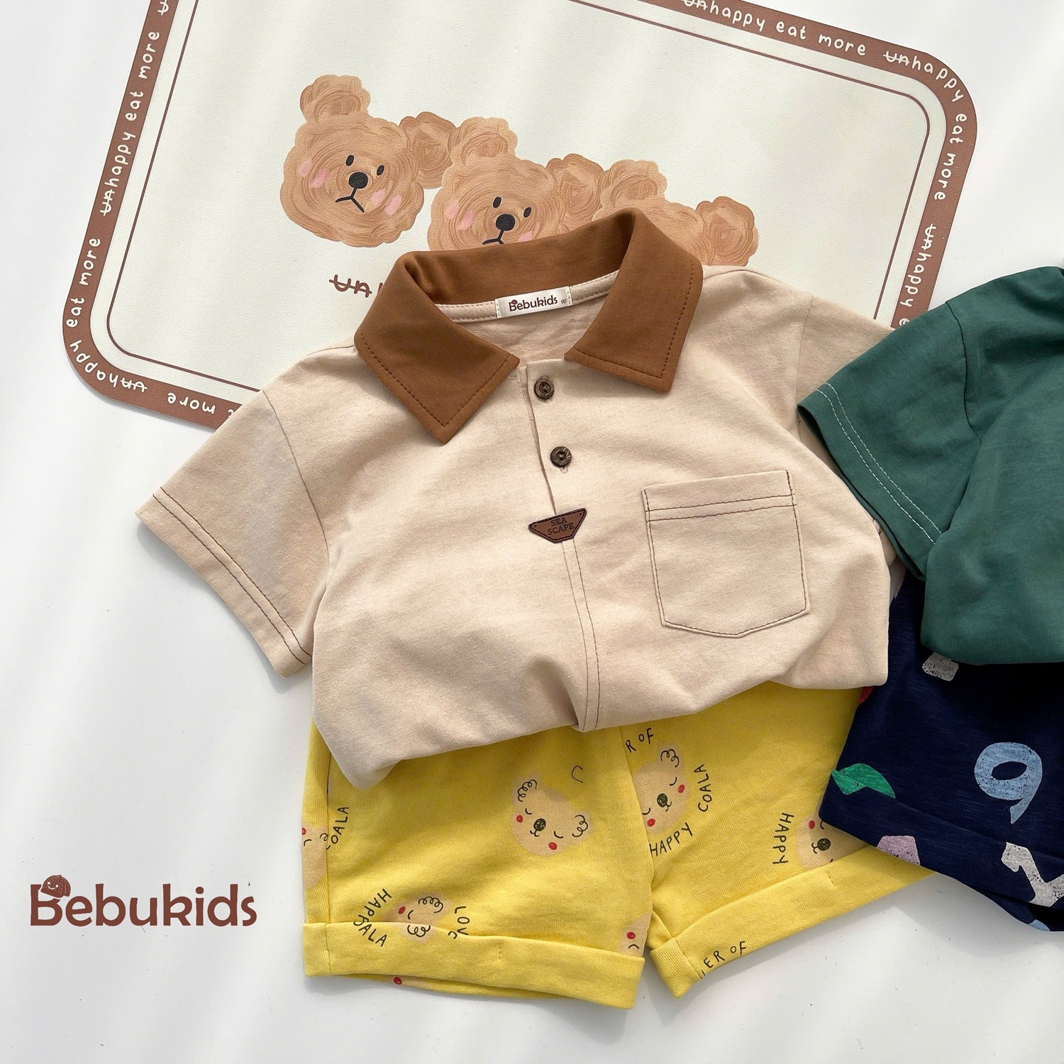 SB2232- bộ polo diễu chỉ nổi túi ngực phối quần gấu, chữ số