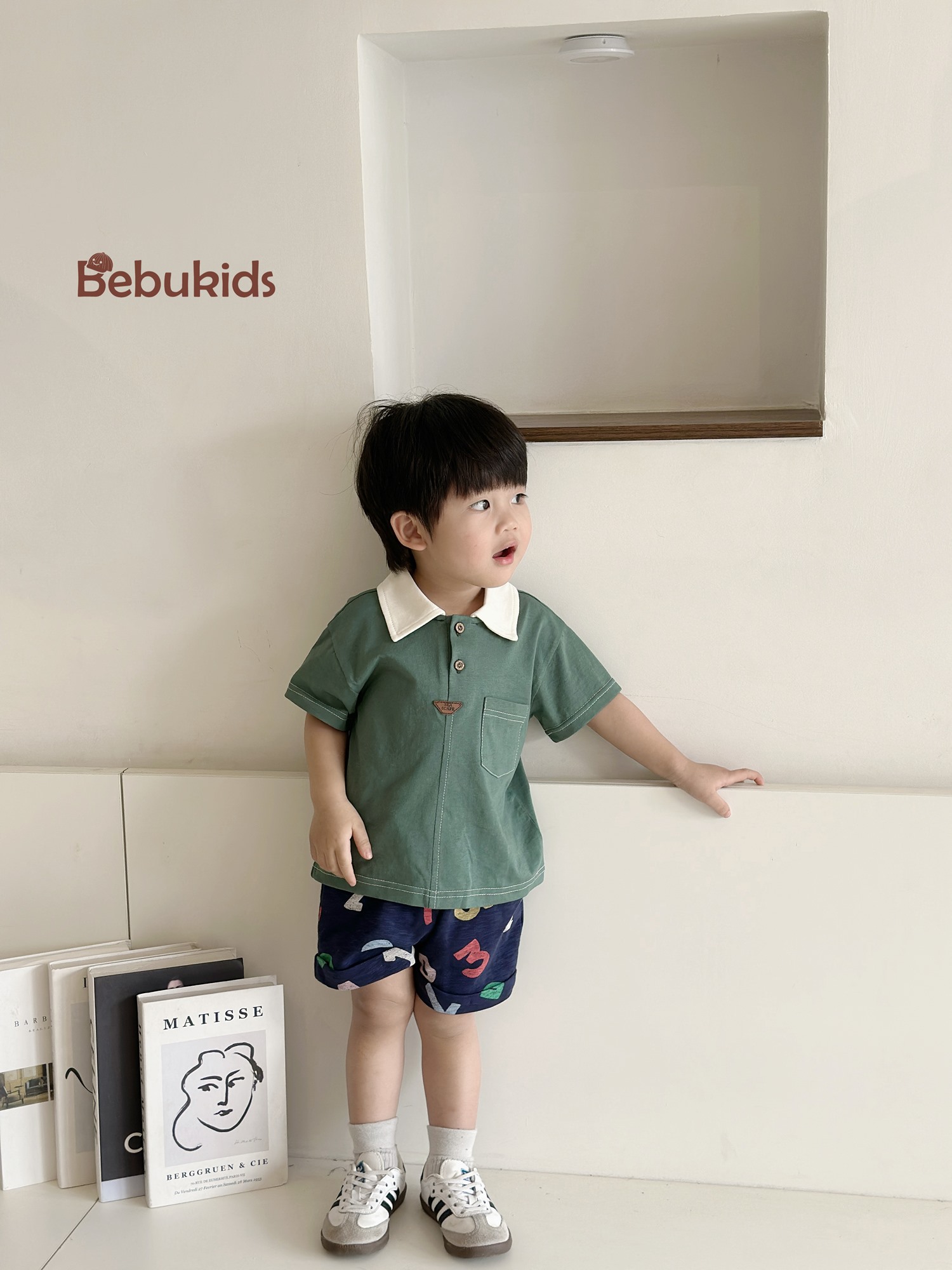 SB2232- bộ polo diễu chỉ nổi túi ngực phối quần gấu, chữ số