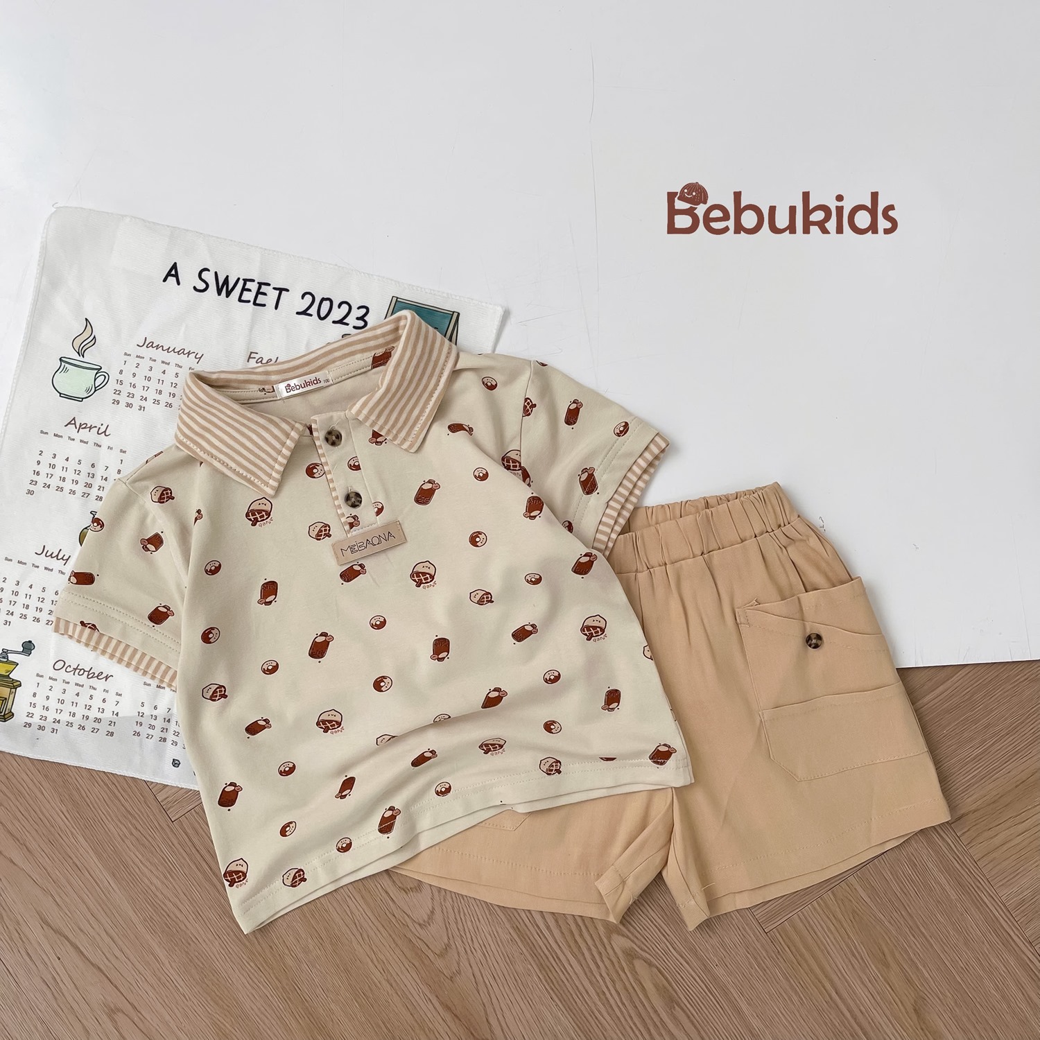 SB2122- bộ polo phối cổ tay nẹp, in họa tiết ngôi nhà, bánh quy bánh cổ be