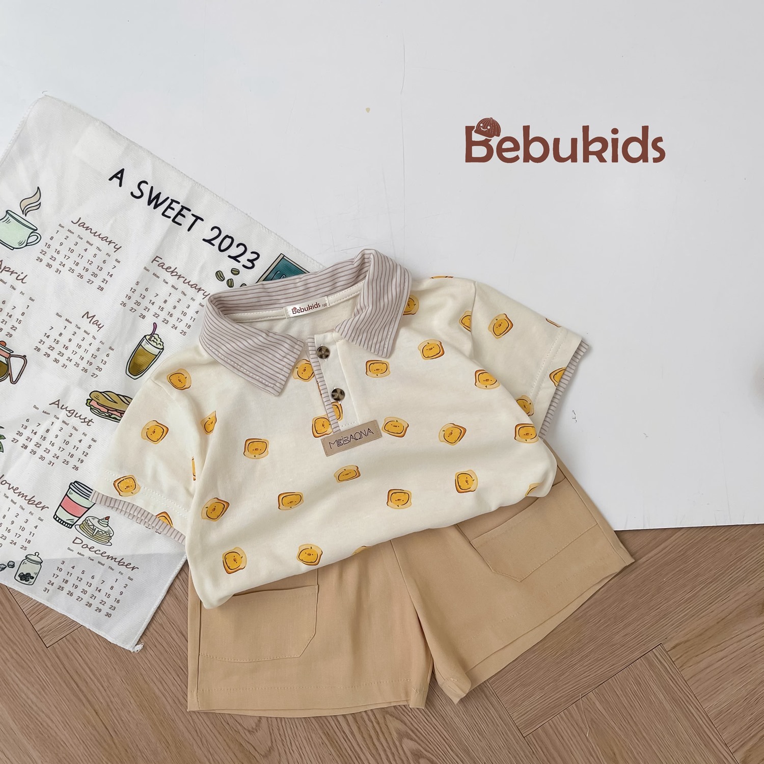 SB2122- bộ polo phối cổ tay nẹp, in họa tiết ngôi nhà, bánh quy bánh mỳ 1