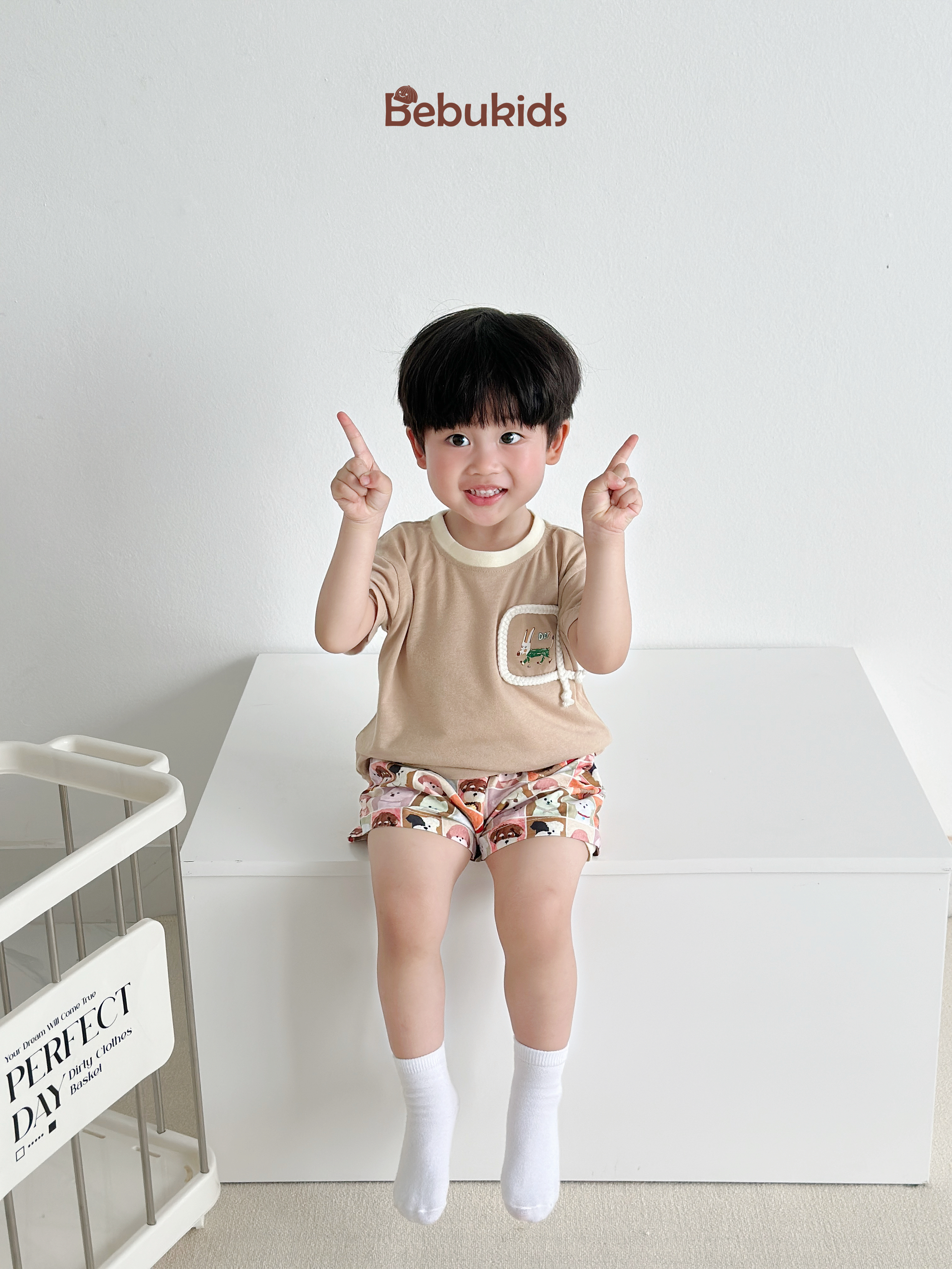 SB2330- bộ cộc tay túi viền dây in chú cũn phối quần karo cún