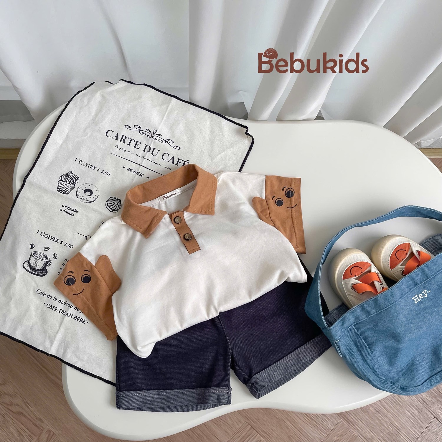 SB2346- bộ polo phối cổ, nẹp tay áo in mắt đính tai be