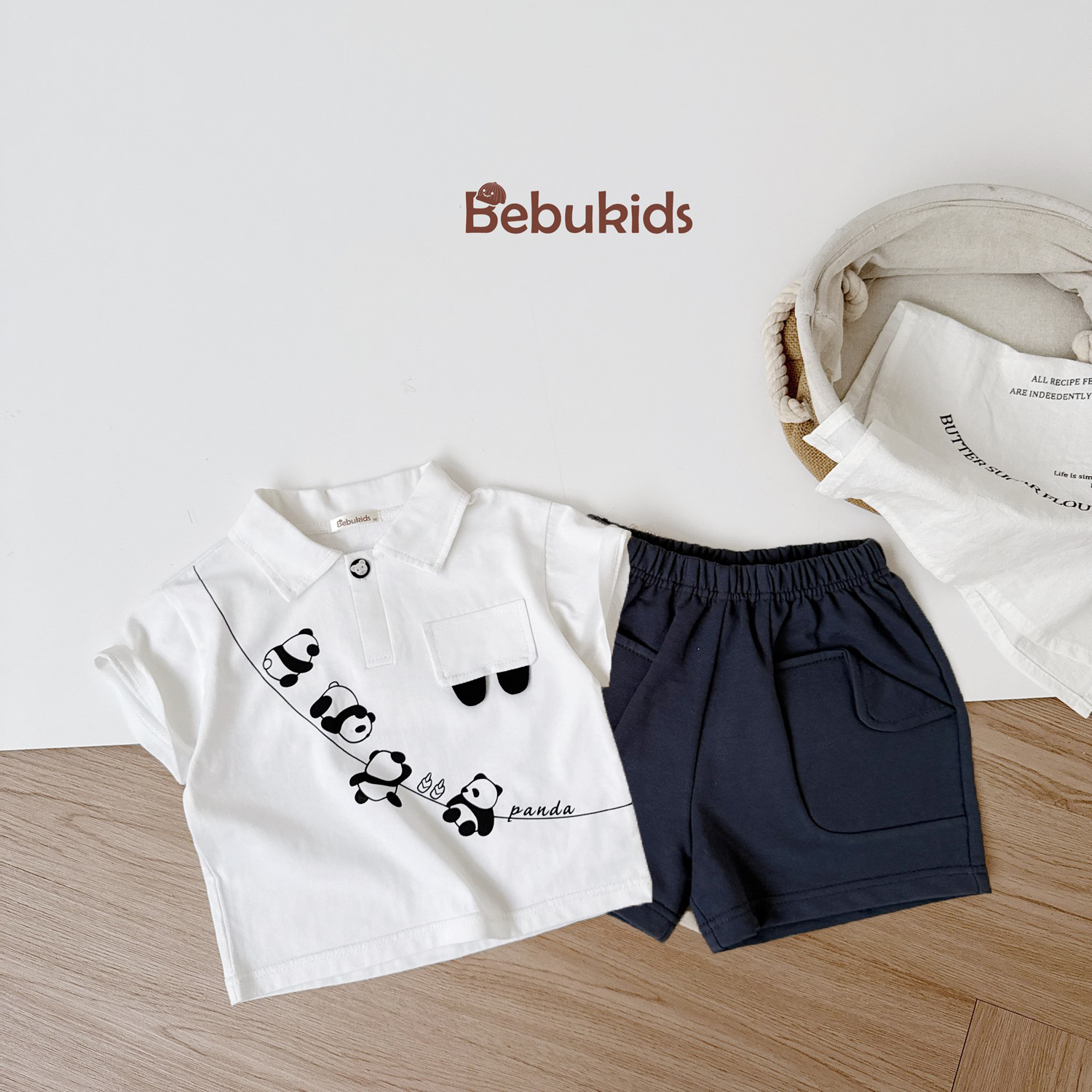SB2231-bộ polo in dây gấu trúc nắp túi ngực trắng 1