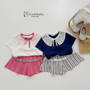 Bộ cộc cổ in chữ thắt nơ cổ, quần kẻ phối bèo