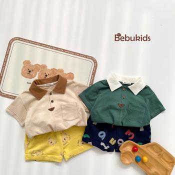 SB2232- bộ polo diễu chỉ nổi túi ngực phối quần gấu, chữ số