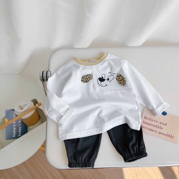 Bộ dài tay bé trai in cũn đính tai báo