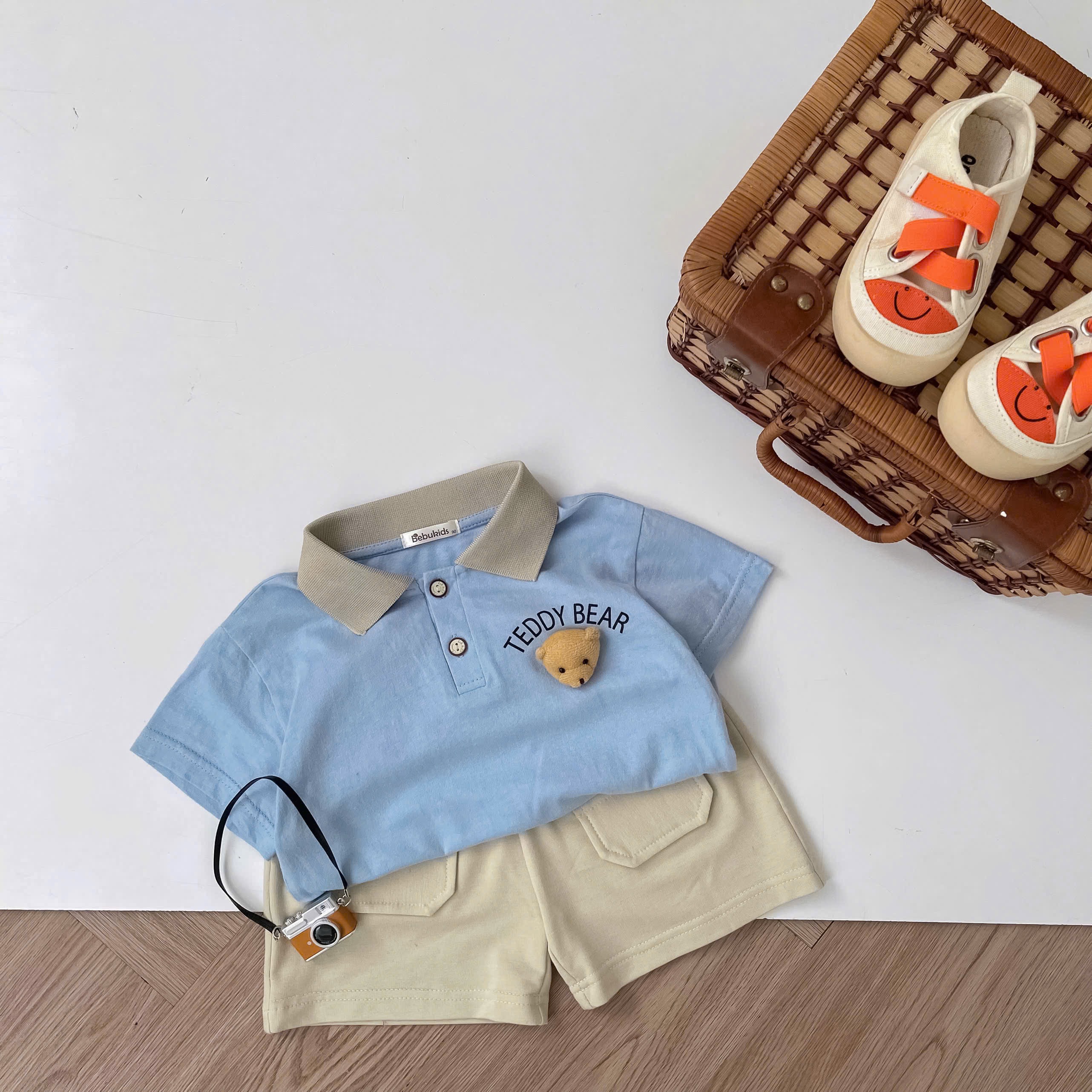 SB2343- bộ polo cọc tay in chữ ngực đính mặt gấu xanh