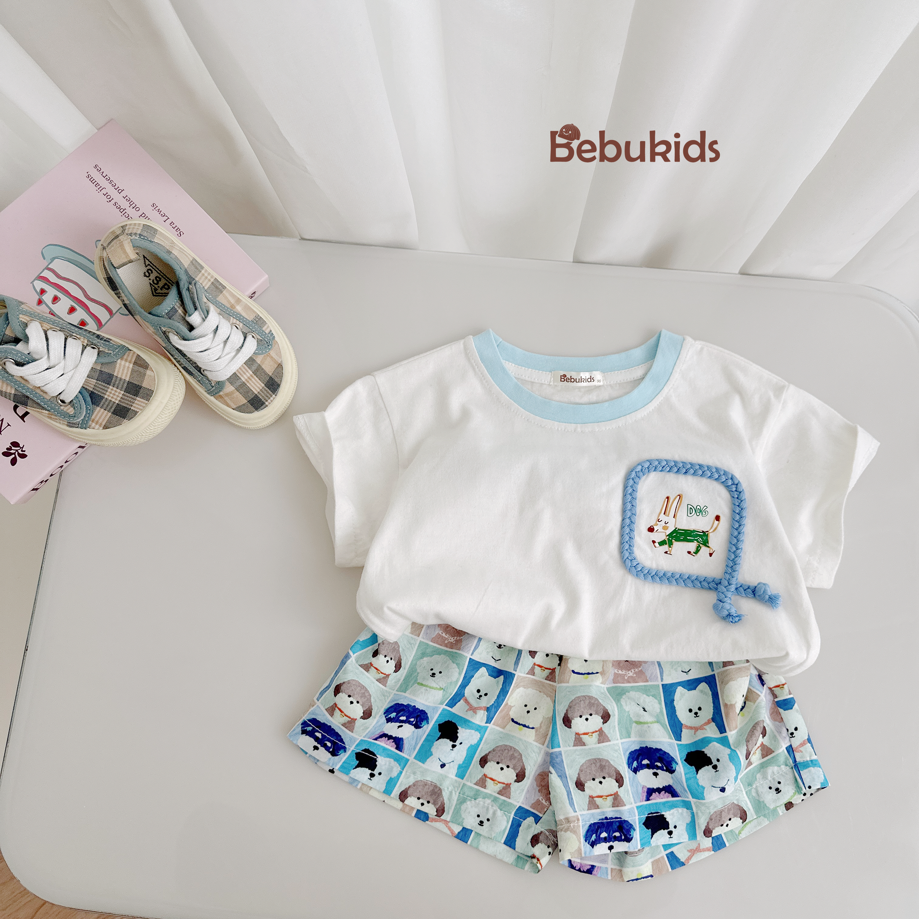 SB2330- bộ cộc tay túi viền dây in chú cũn phối quần karo cún trắng