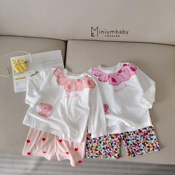 Bộ dài tay bé gái in gấu phối quần tim