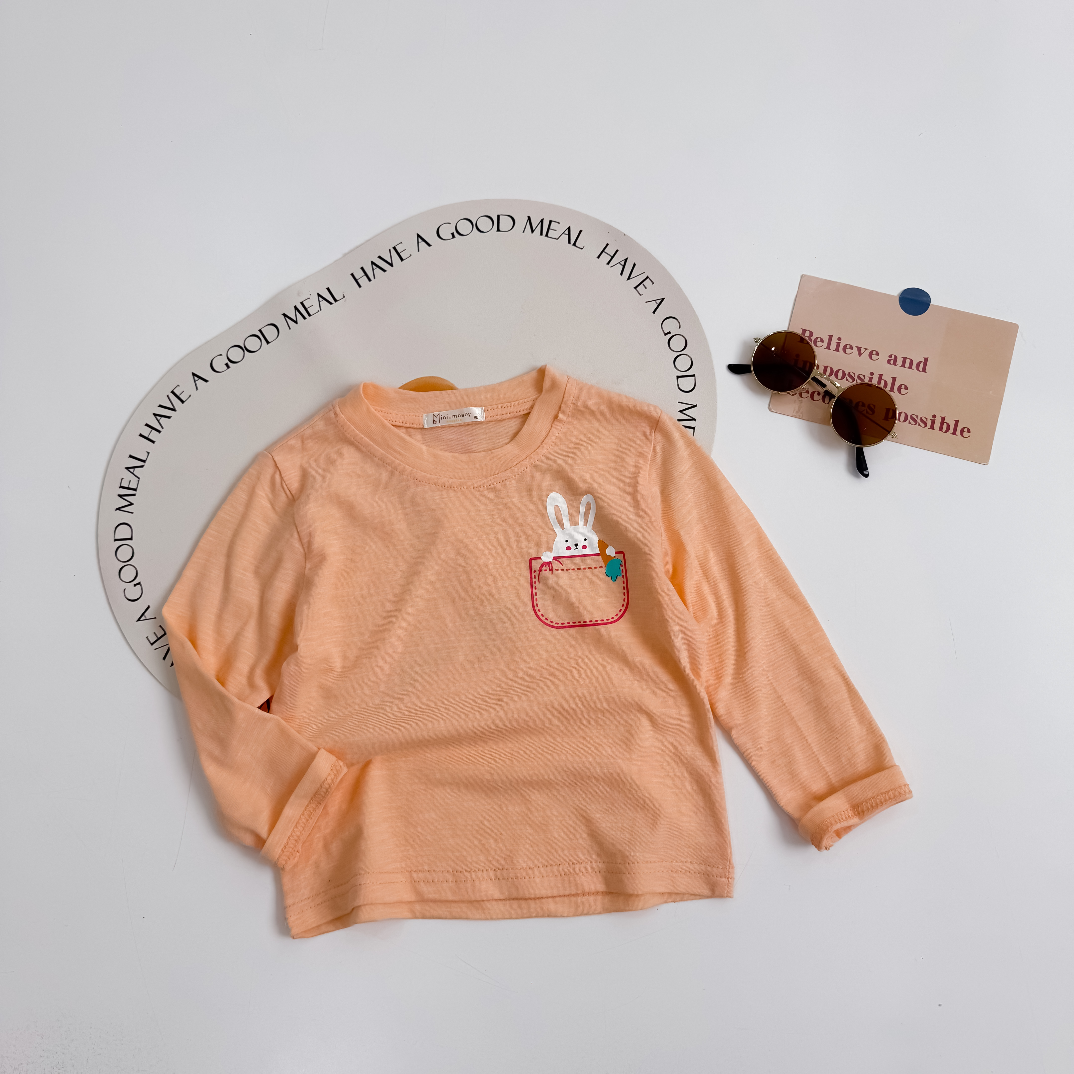 A1663- áo cổ tròn in túi, đầu thú via thường cam tươi