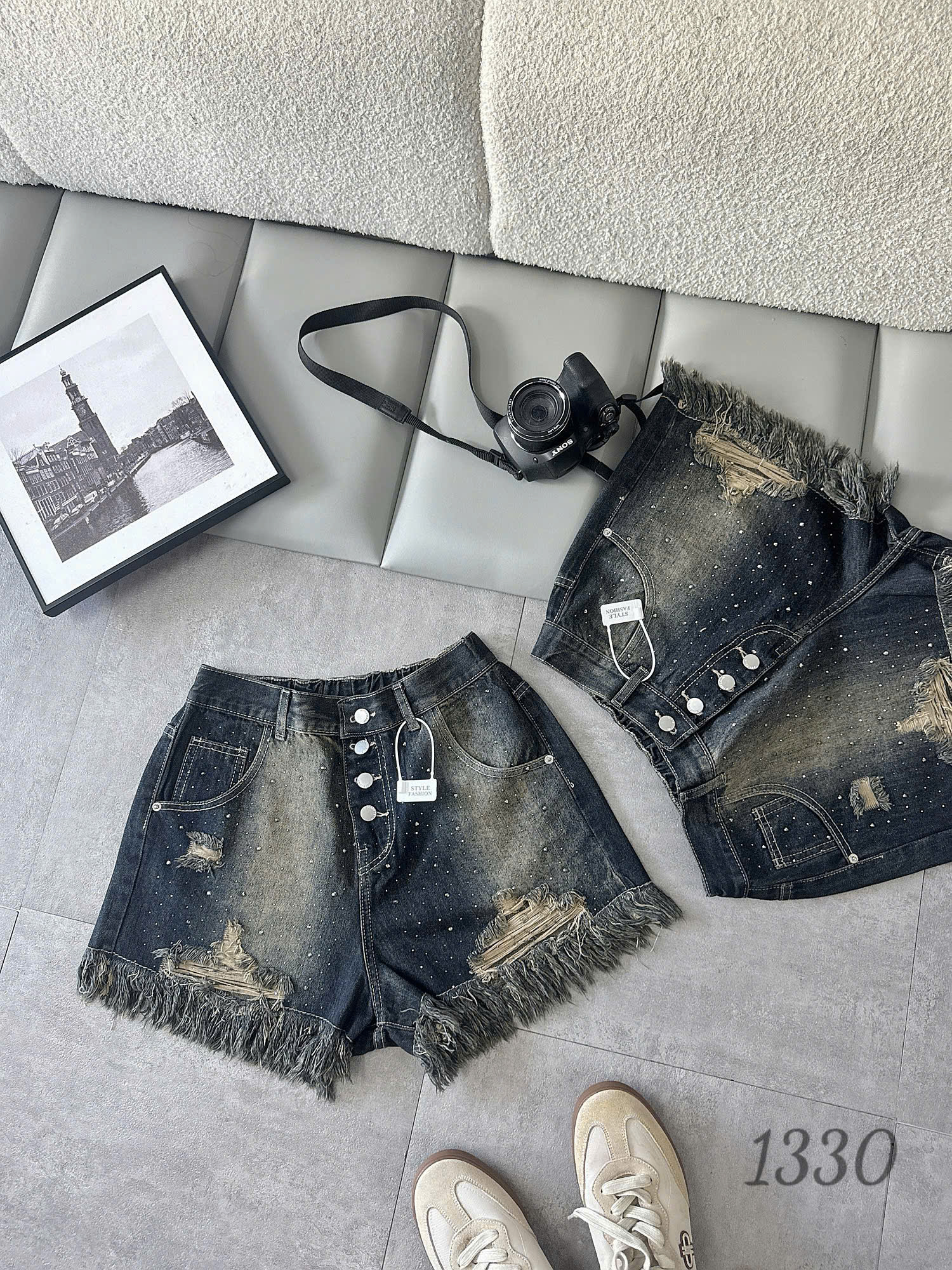 Chi tiết hàng 4 nút ép đá và lai tua rua quần short jean bigsize T-QSJ1330