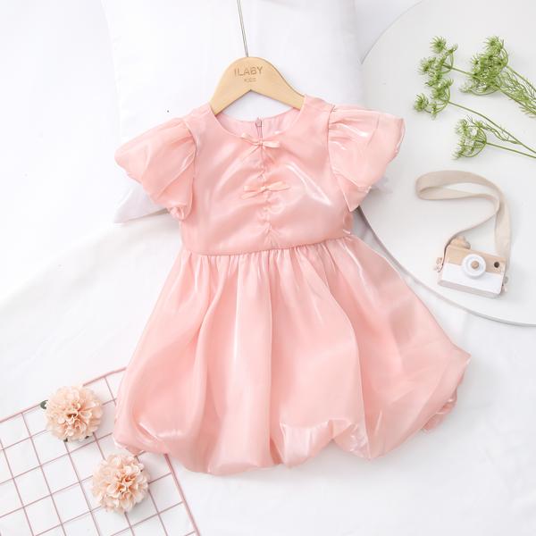 Váy tơ óng nhún nơ nhực