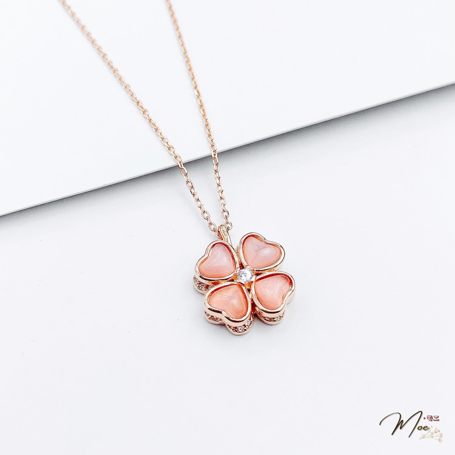 D214 - Dây chuyền cỏ 4 lá xoay thạch anh xi vàng hồng