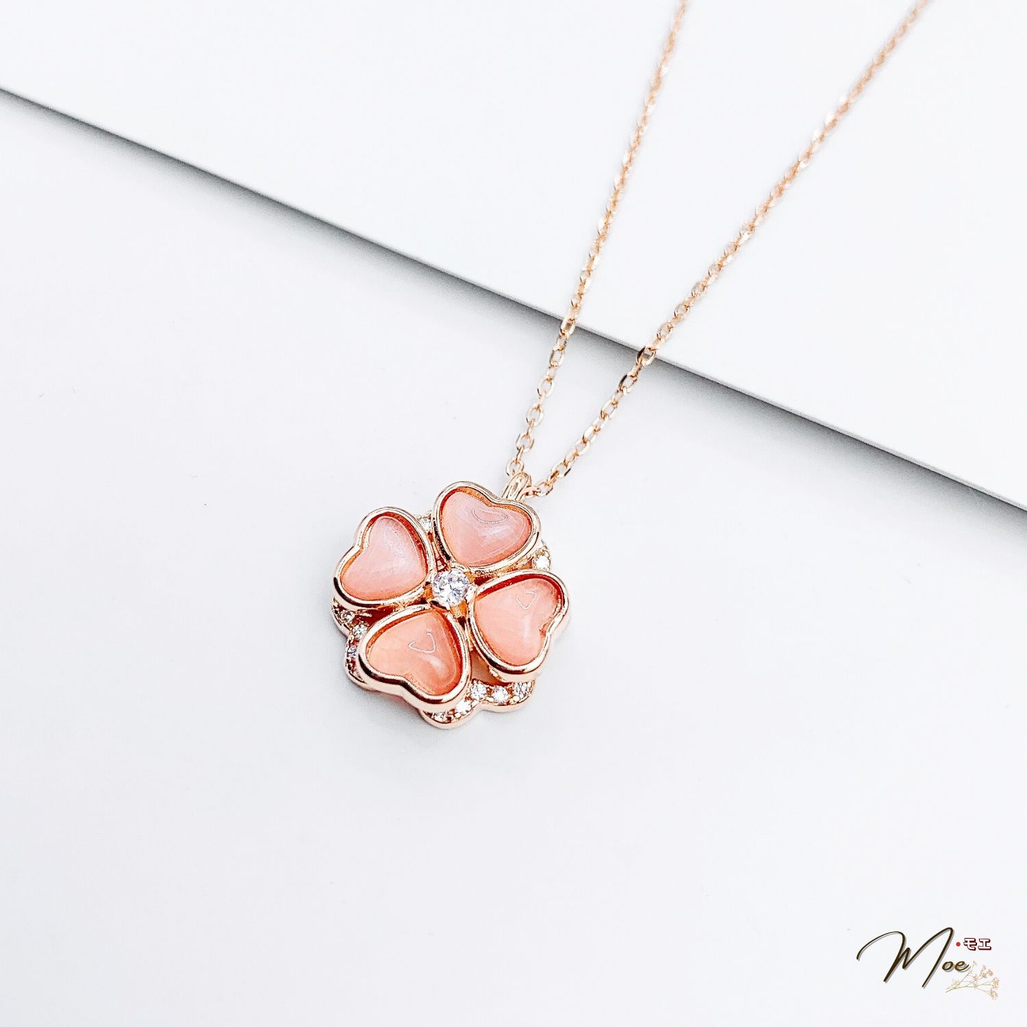 D214 - Dây chuyền cỏ 4 lá xoay thạch anh xi vàng hồng