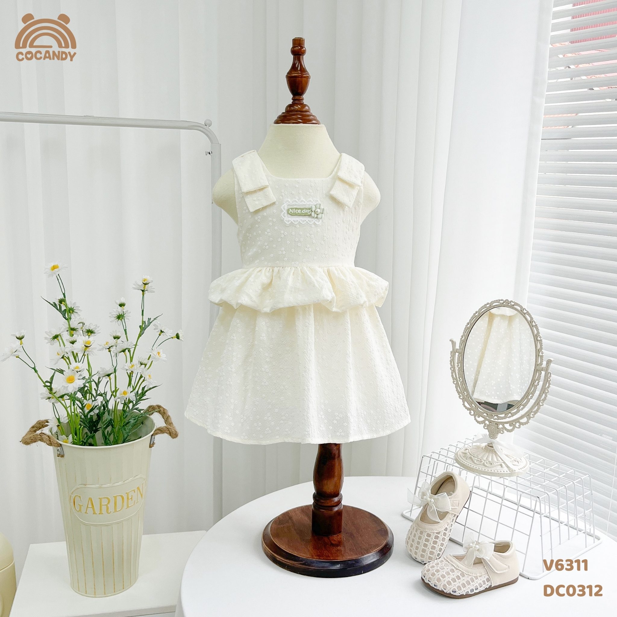 Váy 2 dây BE nơ vai nhún eo tag hoa CCD