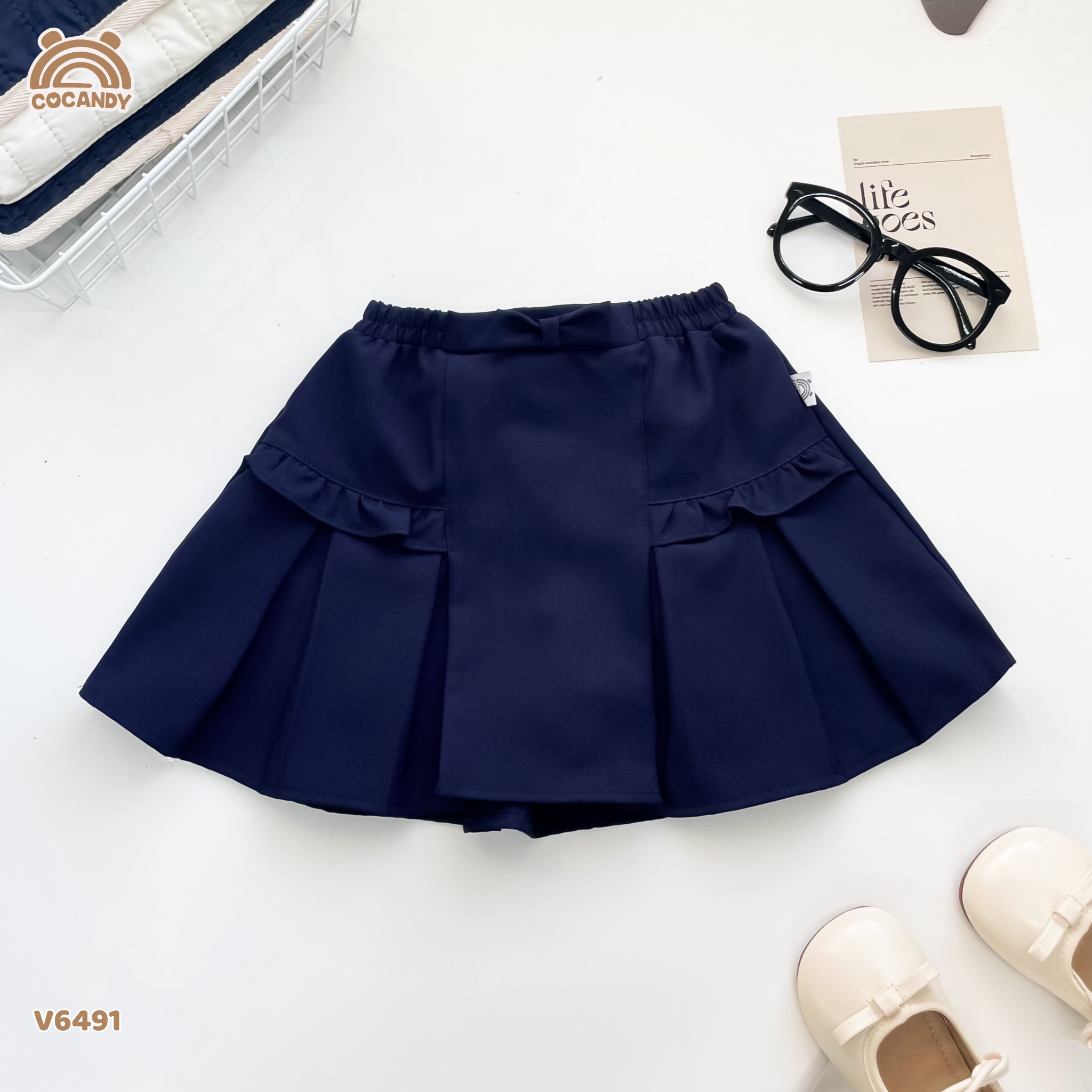 Chân váy cộc XANH nhún cạnh phối nơ xếp ly