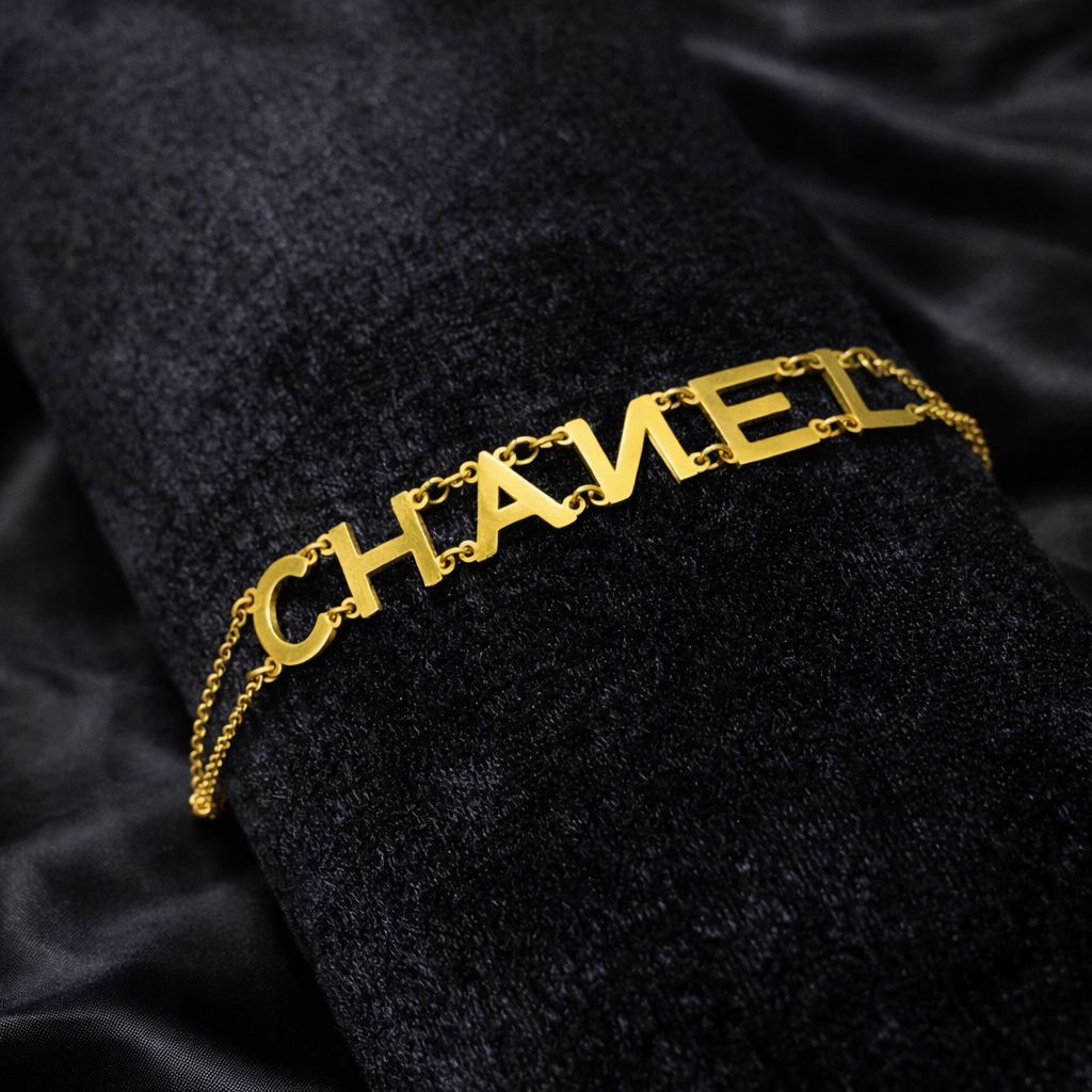 vòng tay titan vàng xích chữ CHANEL