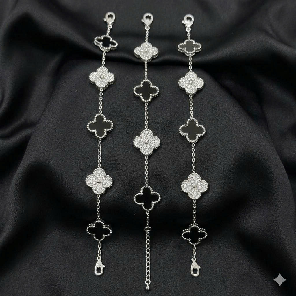 Vòng tay van cleef đá đen xen kẽ đá kim cương màu bạc