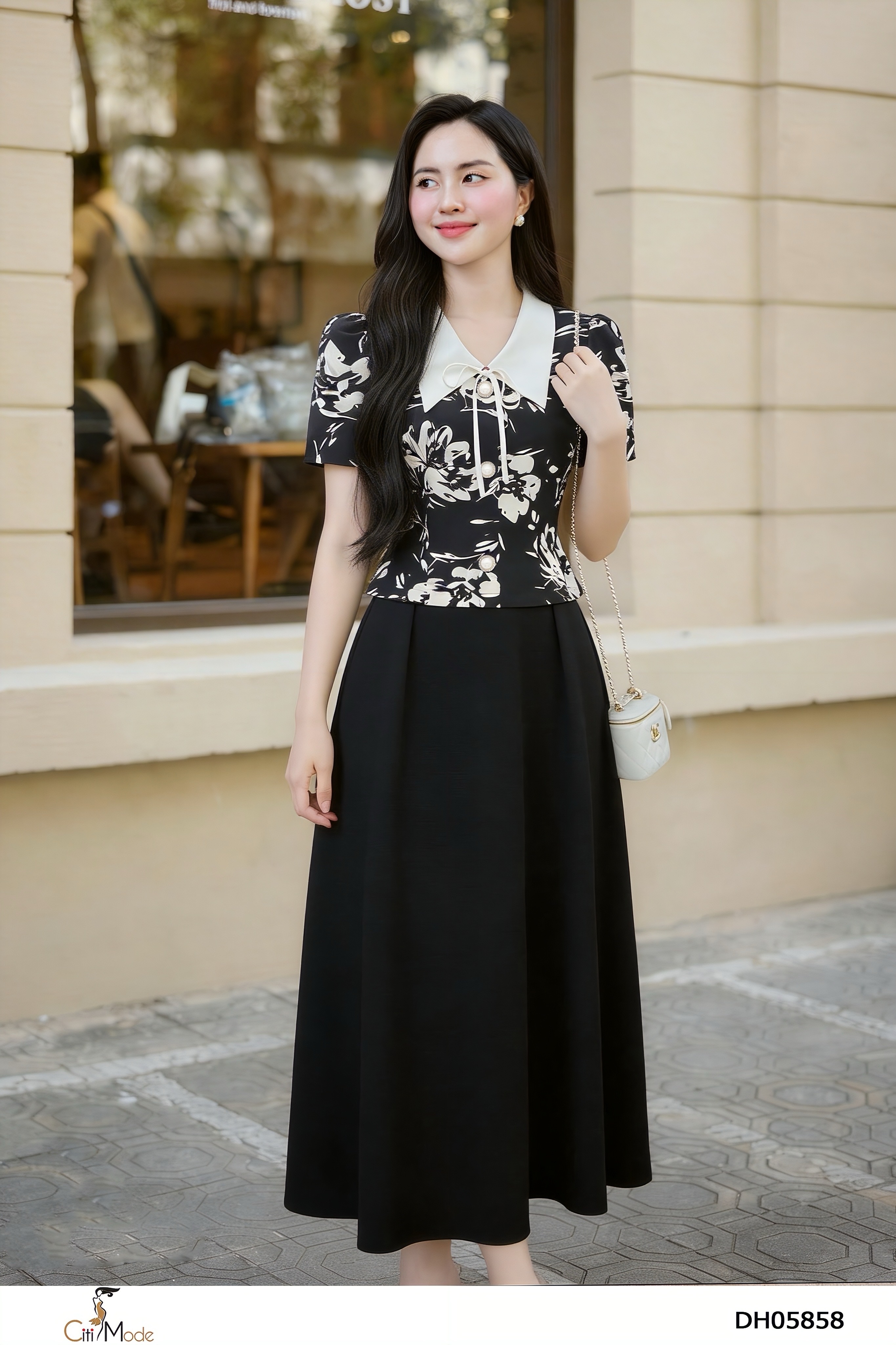 Đầm xòe đen phối hoa đên cổ trắng nơ tay cọc