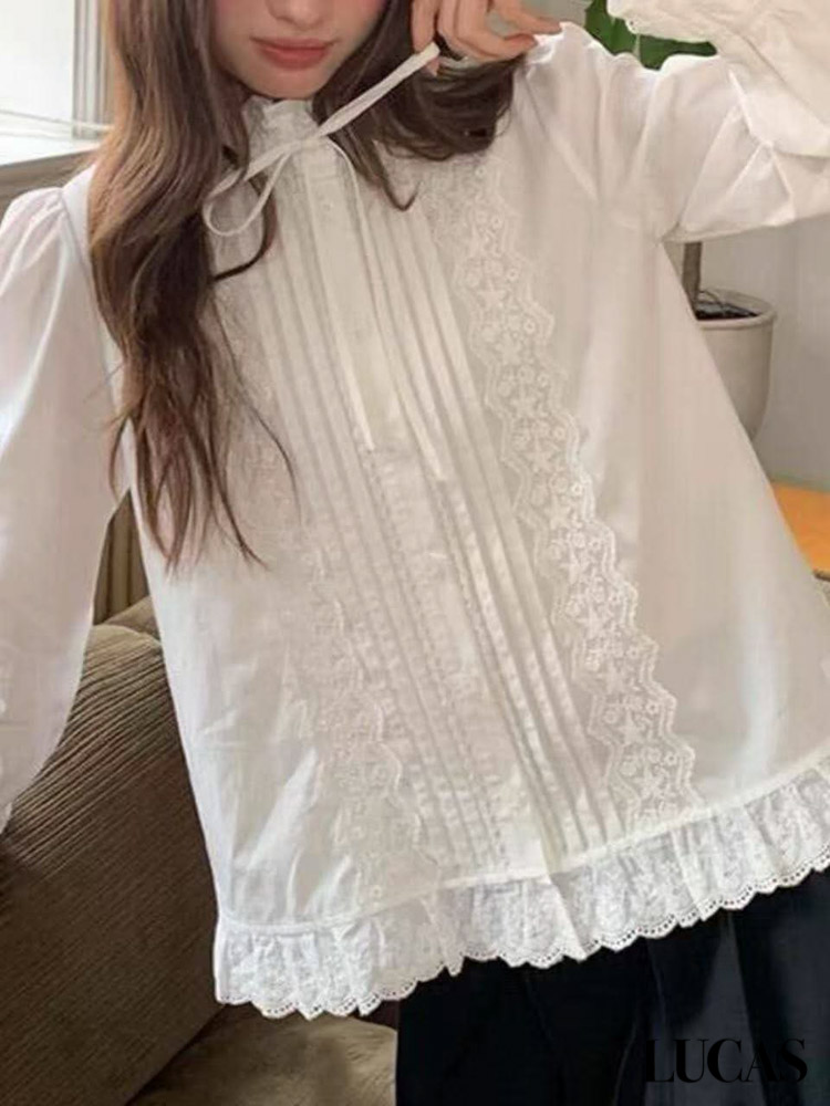 Áo sơ mi thô cài cúc dáng dài cổ xếp buộc nơ, xếp ly + phối ren 2 bên nẹp gấu xòe tay loe_thumbnail_1