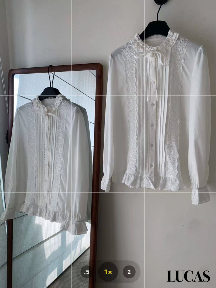 Áo sơ mi thô cài cúc dáng dài cổ xếp buộc nơ, xếp ly + phối ren 2 bên nẹp gấu xòe tay loe