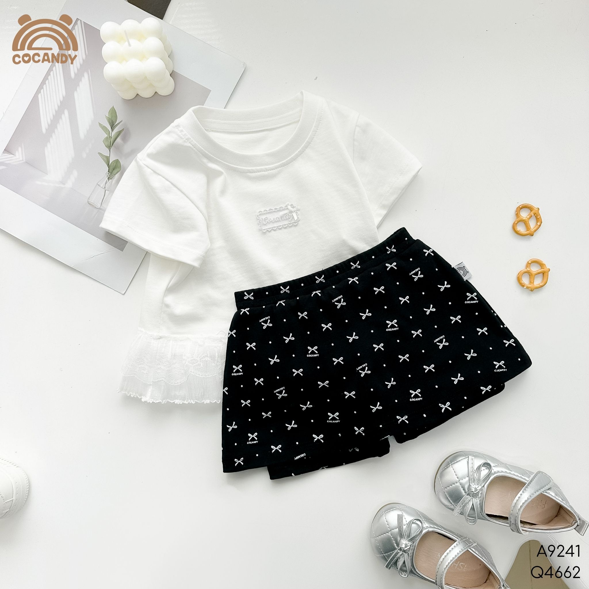 Quần váy legging cộc ĐEN họa tiết nơ Cocandy