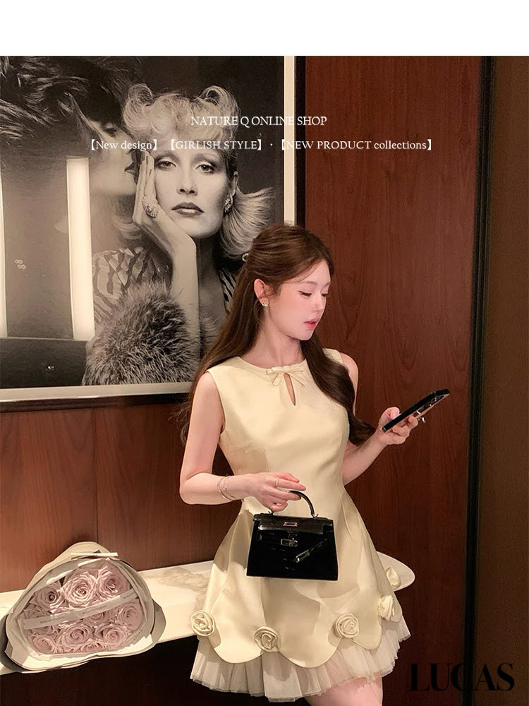 Váy zile khoét giọt lệ đính nơ gấu xòe A lót voan xếp + đính hoa nổi