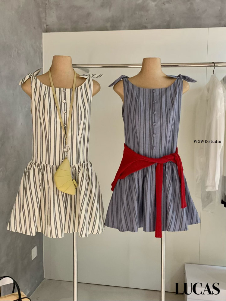 Váy thô dọc cúc bọc buộc nơ vai chân xòe hạ eo