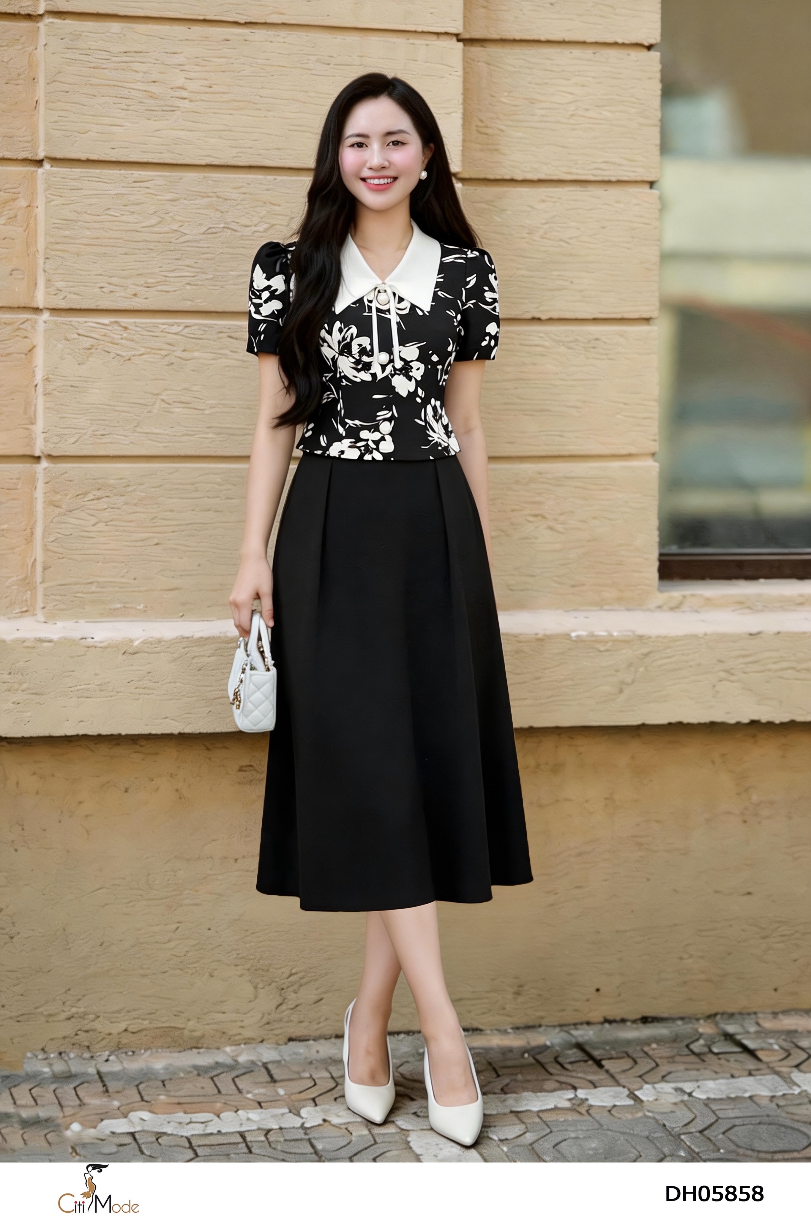 Đầm xòe đen phối hoa đên cổ trắng nơ tay cọc