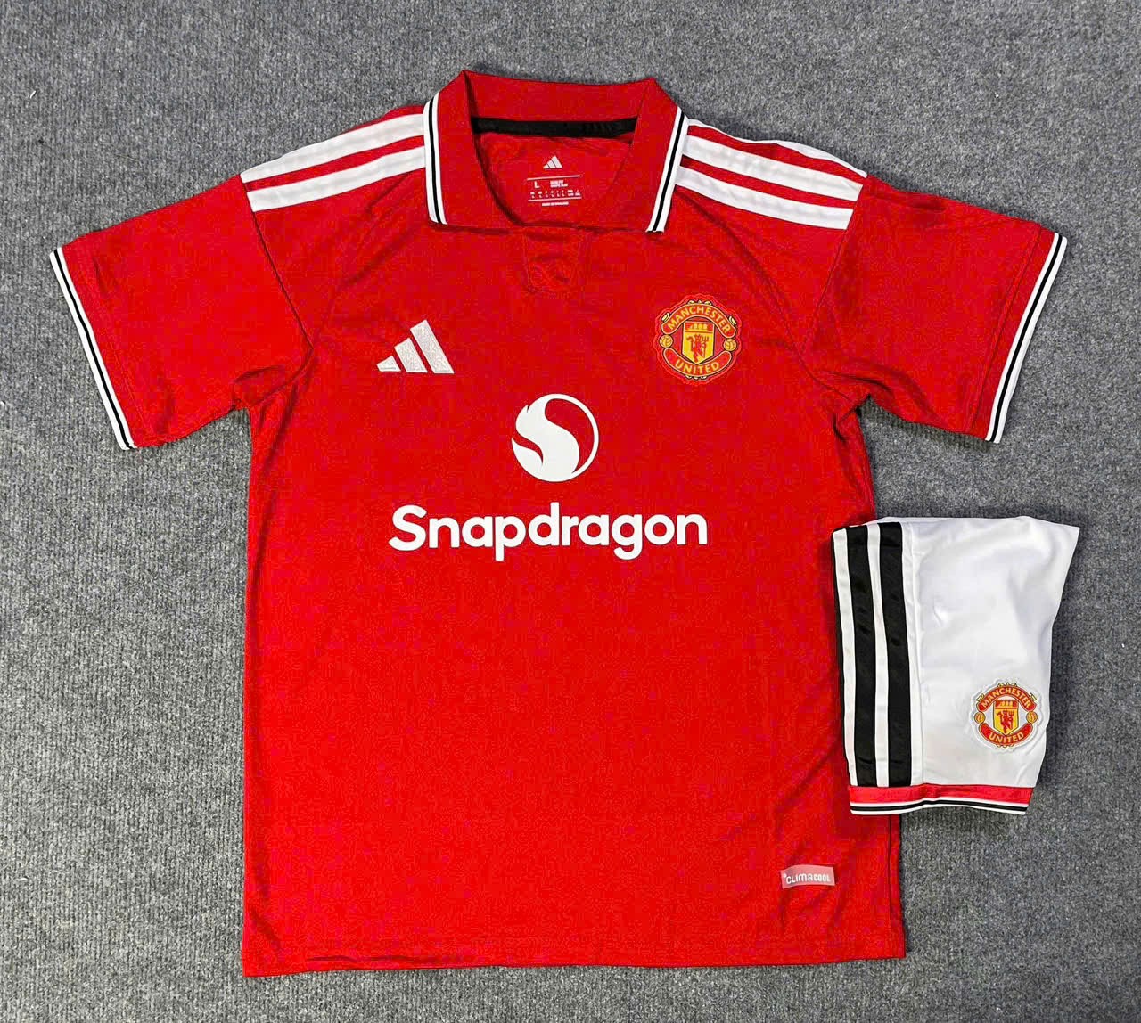Bộ Kid MU sân nhà đỏ 26/27