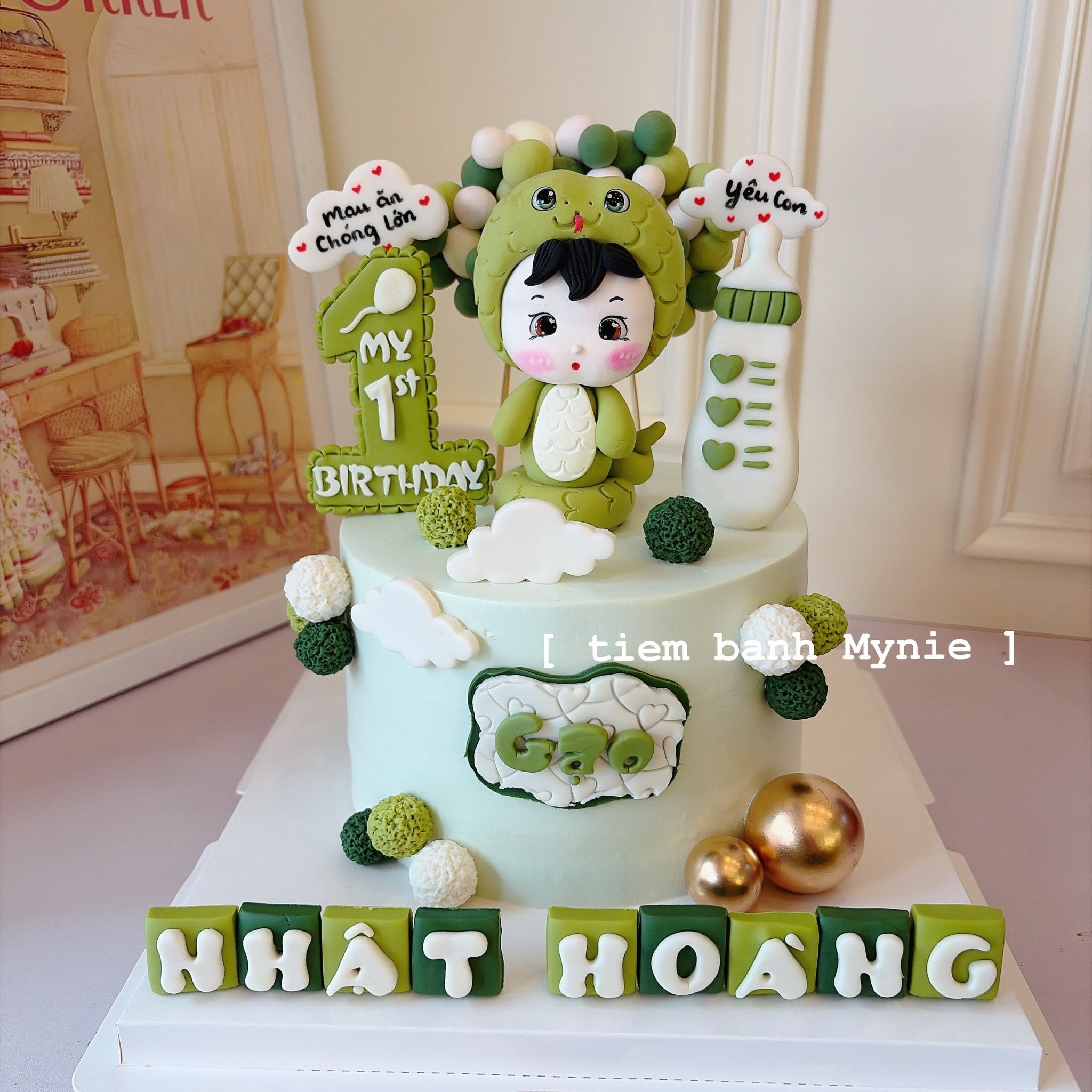 Bánh thôi nôi bé trai tone xanh lá