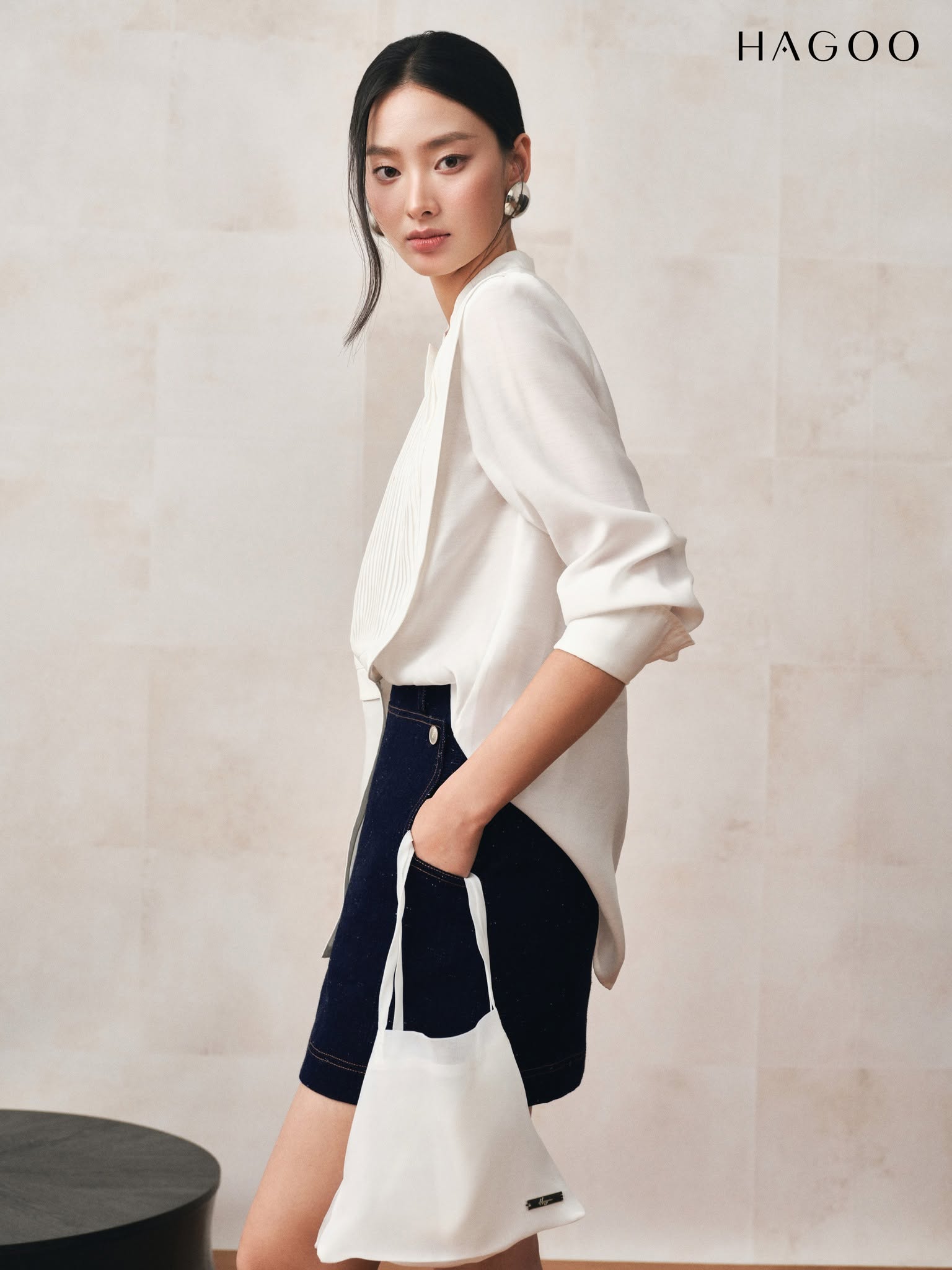HAGOO A-line denim skirt with pockets and integrated waistband.