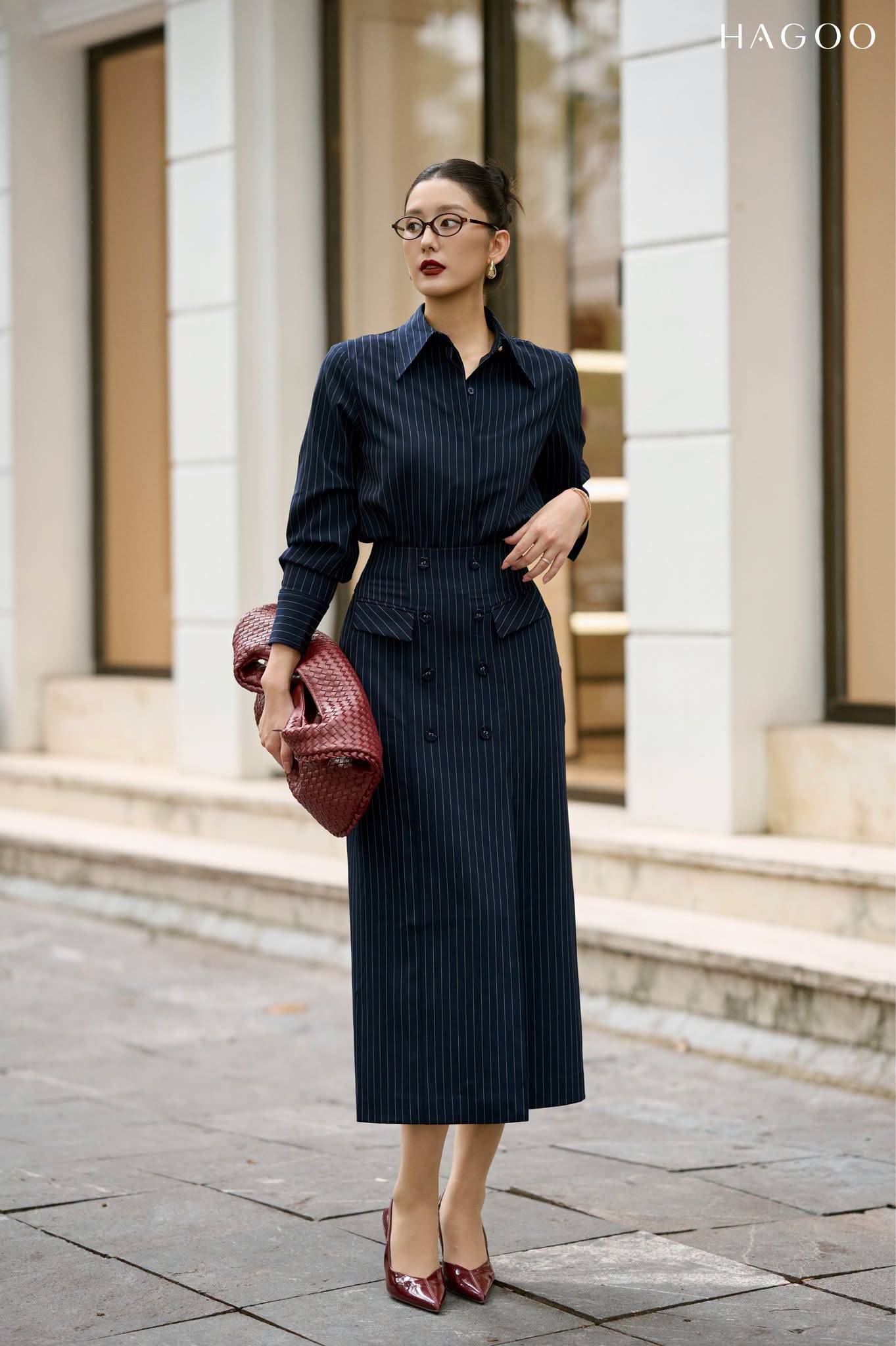 Skirt with double row of buttons and flap pockets.