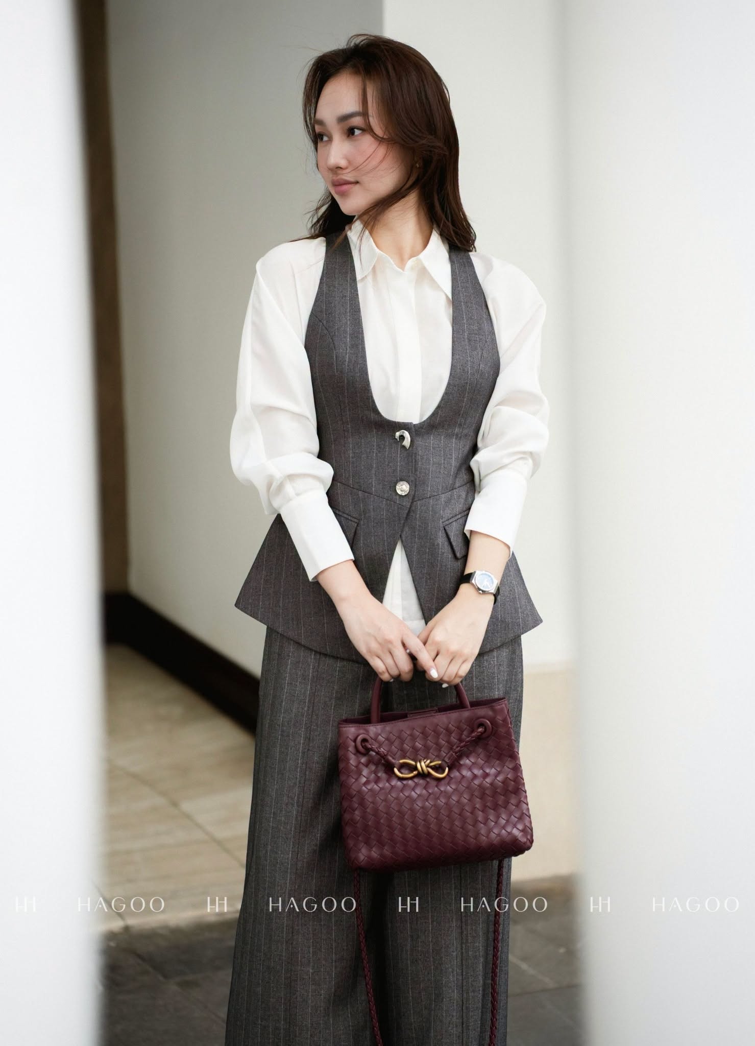 Asymmetrical vest with decorative buttons