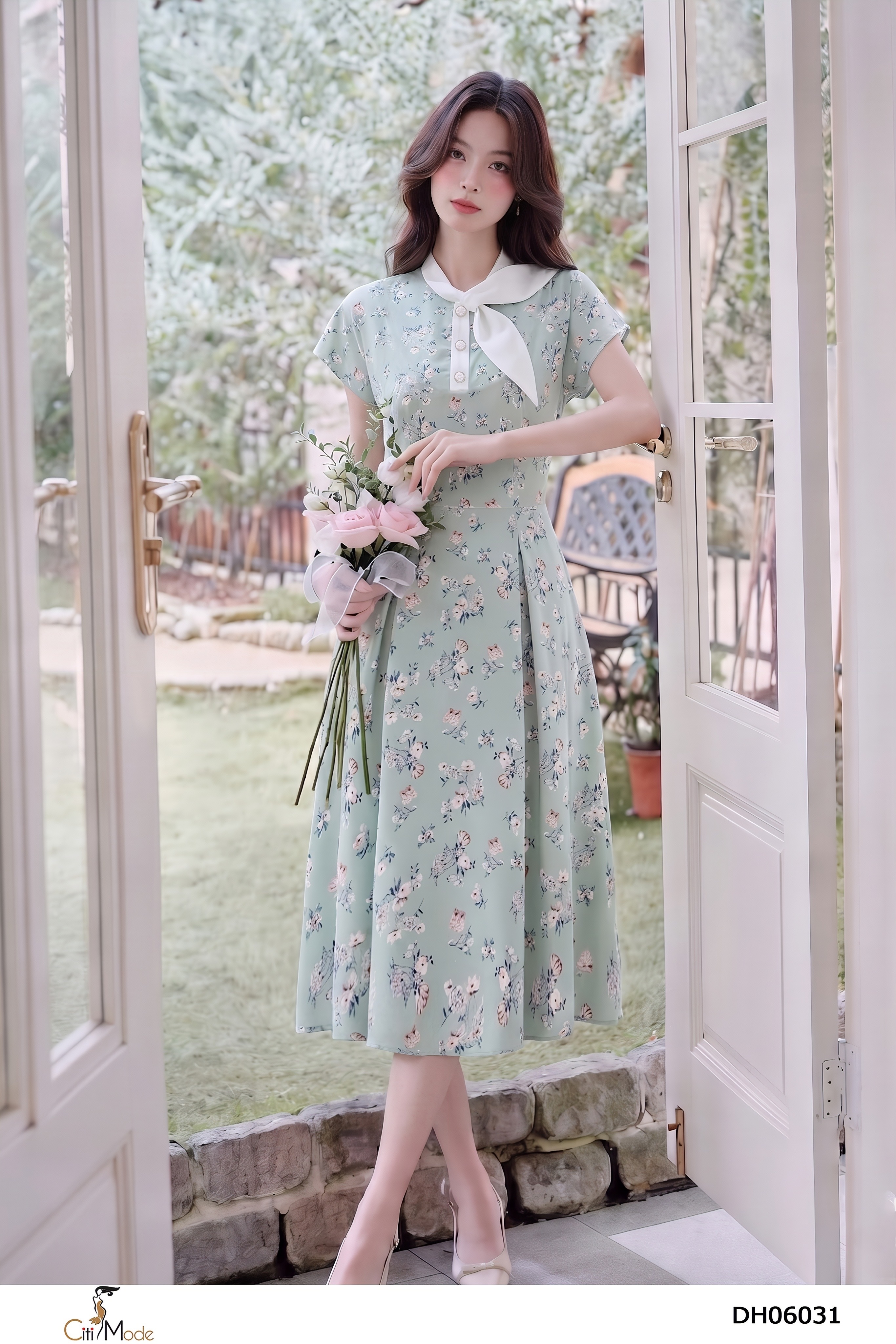 Đầm xòe hoa xanh cổ nơ lệch tay chờm