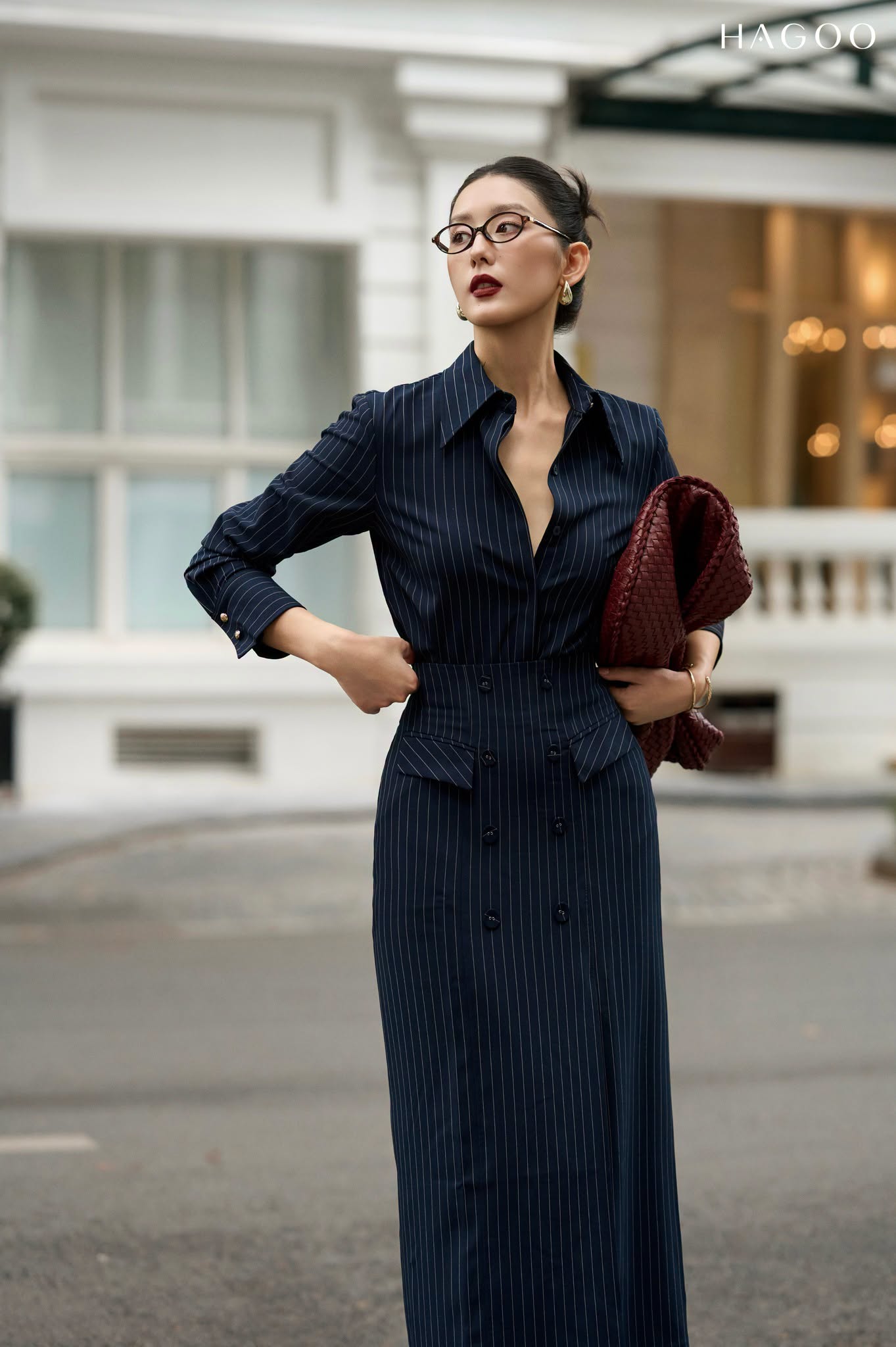 Skirt with double row of buttons and flap pockets.