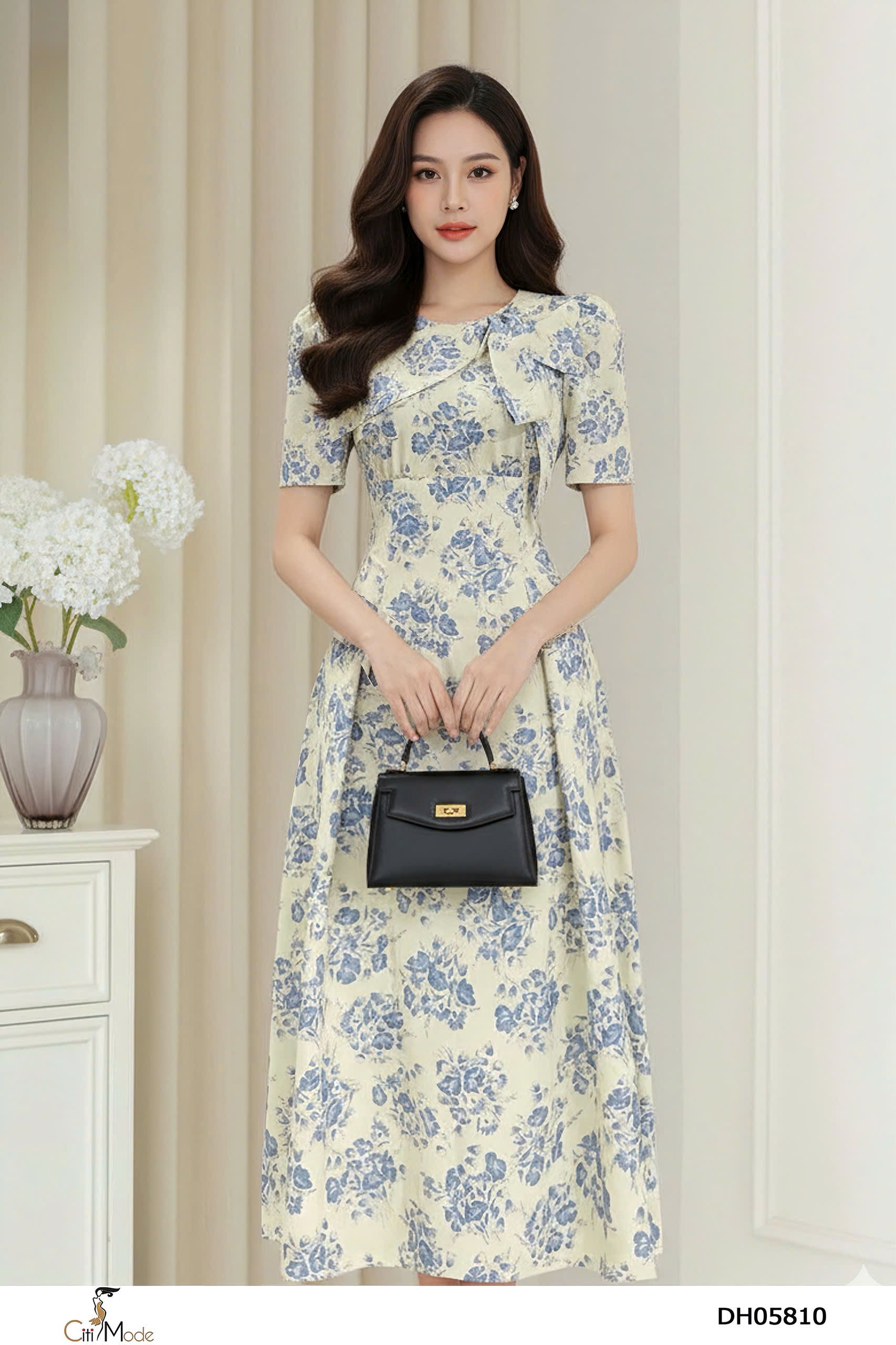 Đầm xòe hoa xanh cổ vạt nơ cách điệu tay cọc