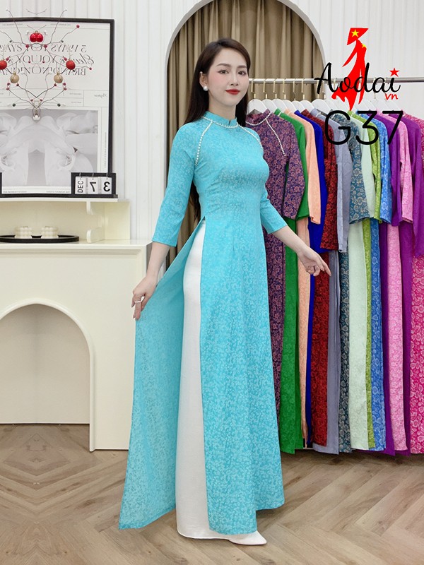 Áo dài Gấm G37 màu xanh ngọc cổ cao 2cm tay lỡ đính hạt ngọc