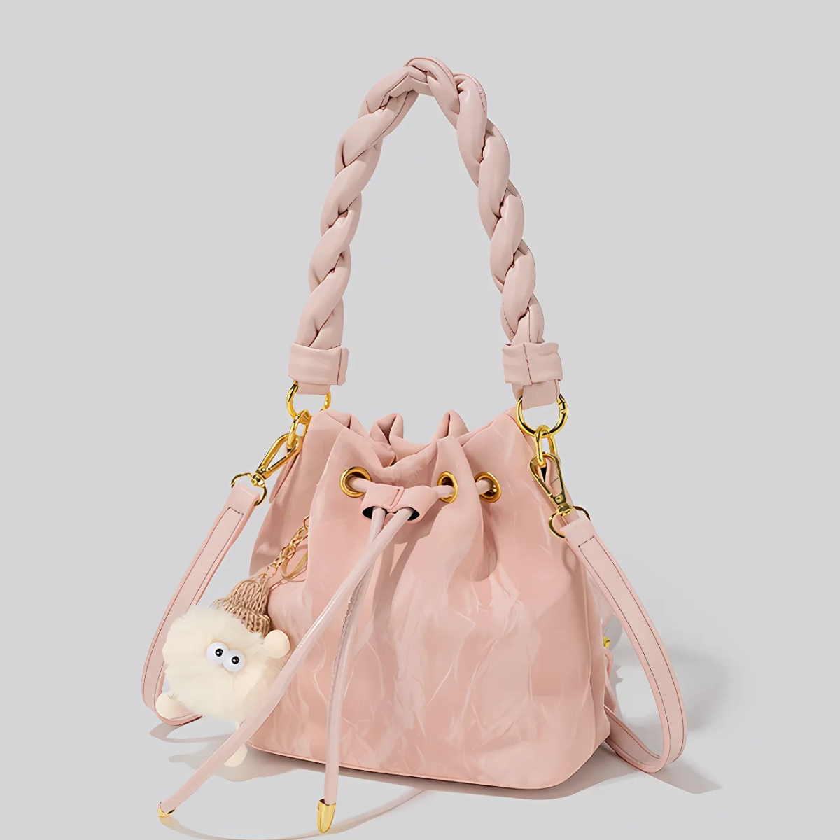 UHE Moon Puff 2509 – túi bucket da cao cấp, quai xoắn thời trang, charm bông xinh xắn, 3 màu hồng - trắng kem - xám bạc