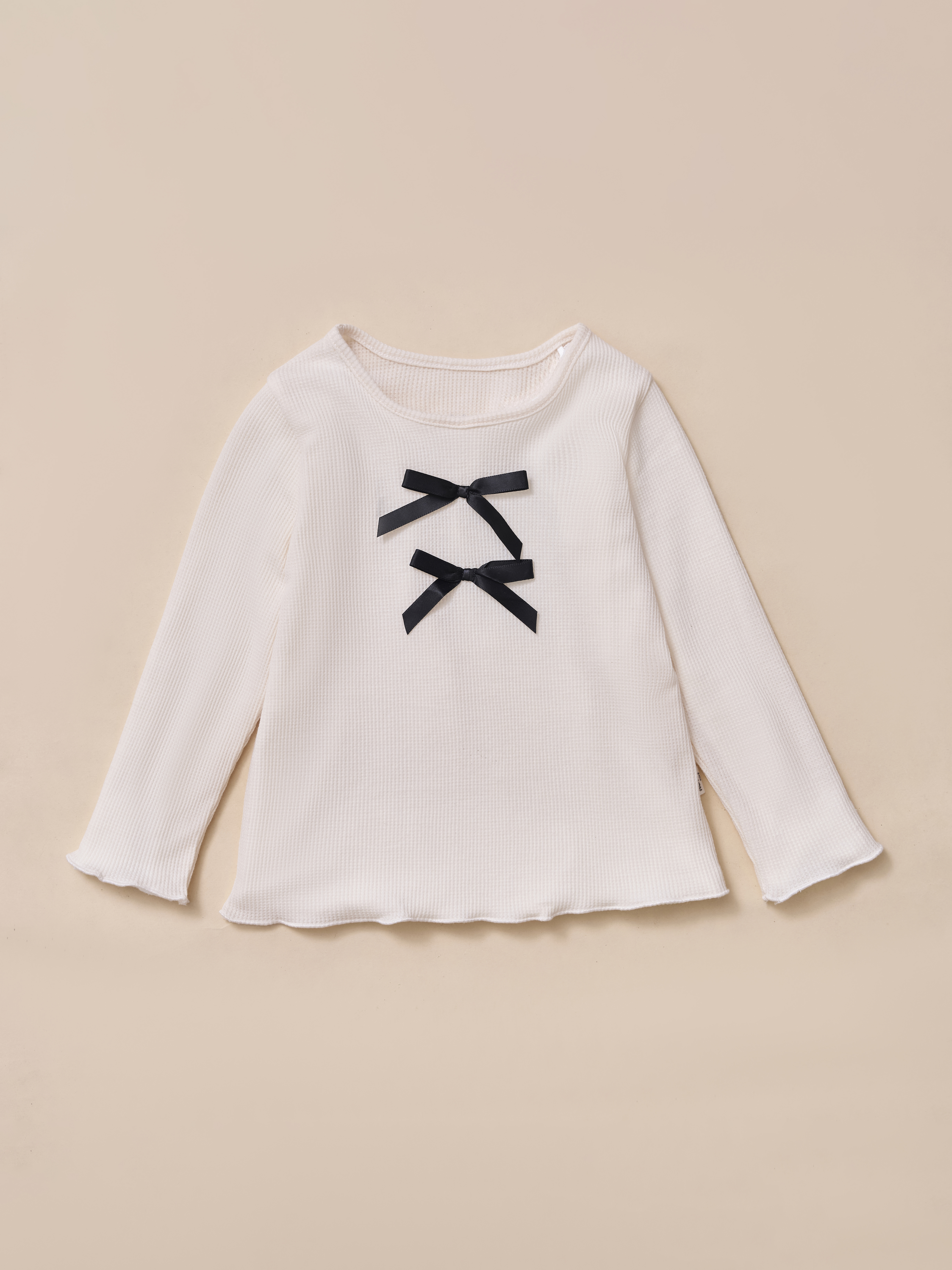 Áo cổ tròn đính nơ cuốn bèo gấu