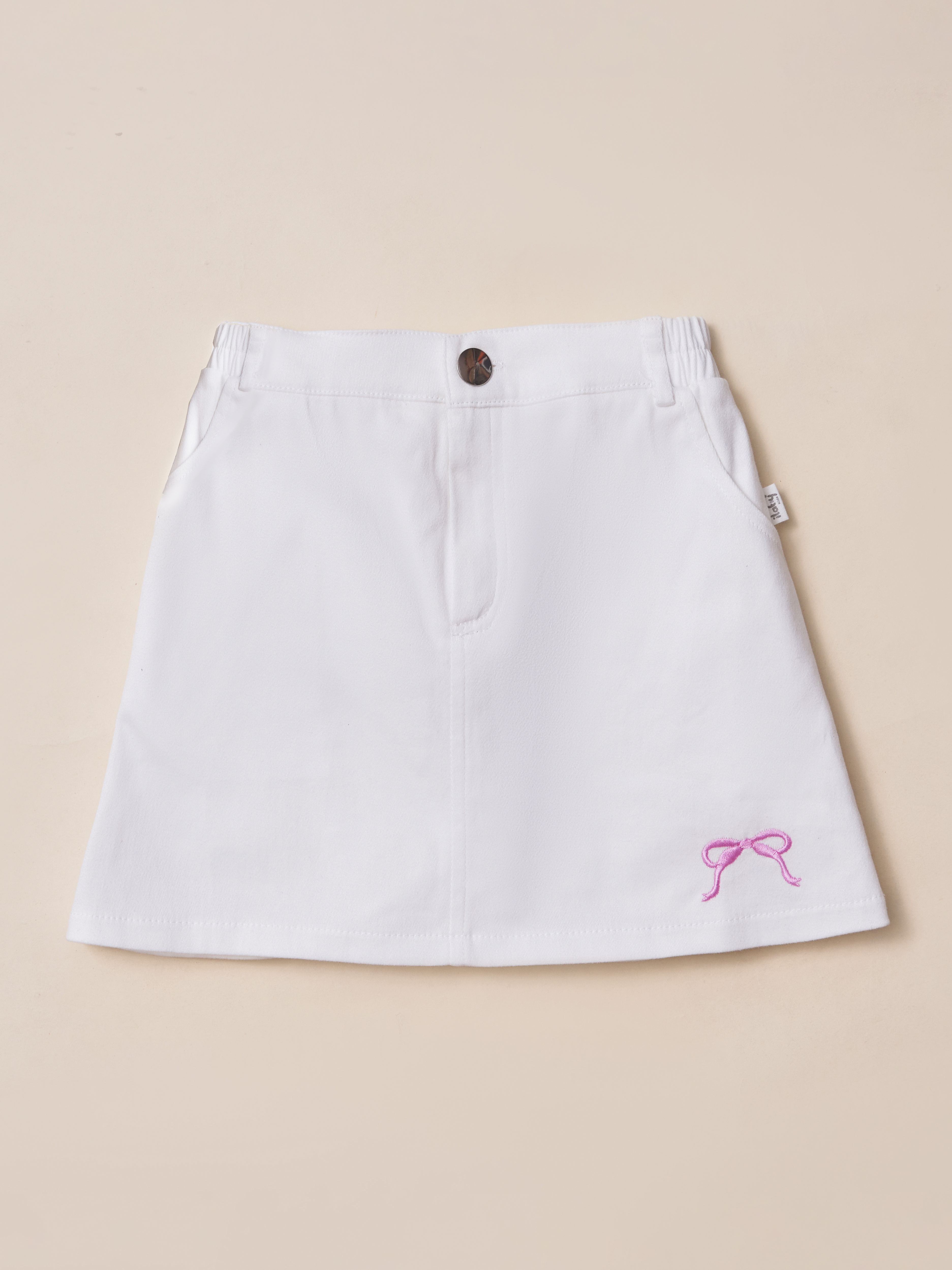 Chân váy kaki thêu nơ