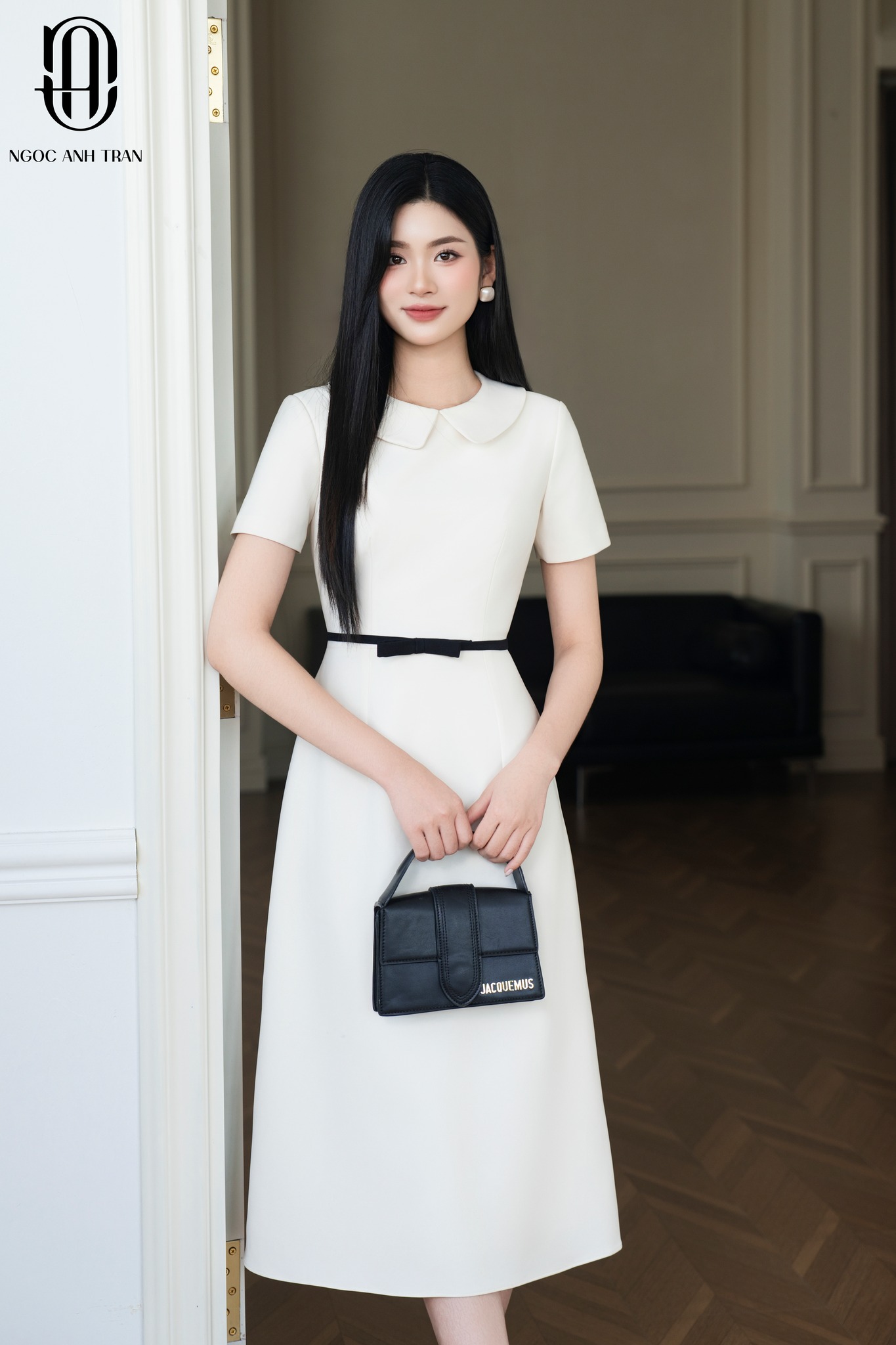 D137 - Váy kem dáng A phối nơ eo đen