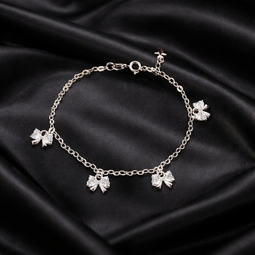 Vòng tay bạc xi kim nơ tim trắng