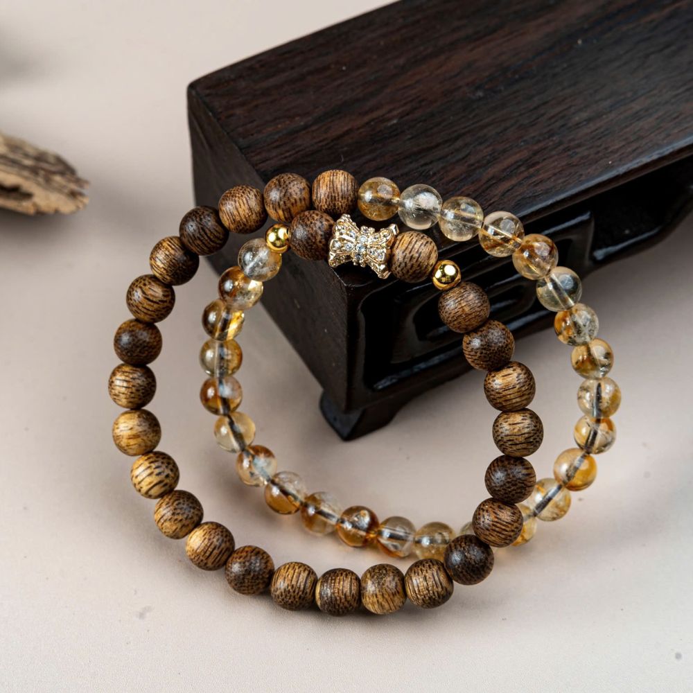 PT158 - Chuỗi vòng trầm 54 hạt mix nơ đá thạch anh tóc vàng (Hợp kim mạ vàng)